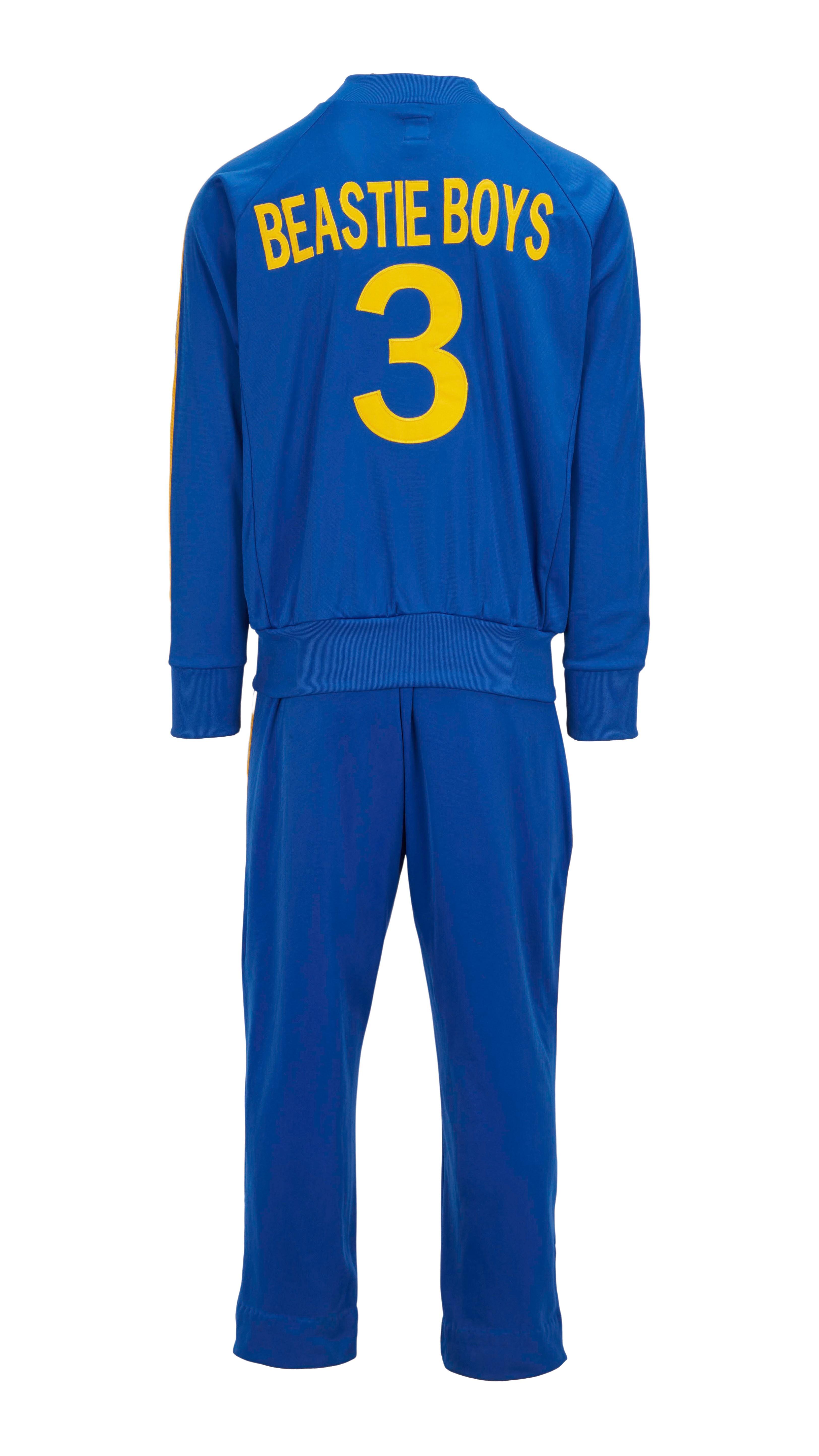 a blue beastie boys tracksuit with the number 3 on the back