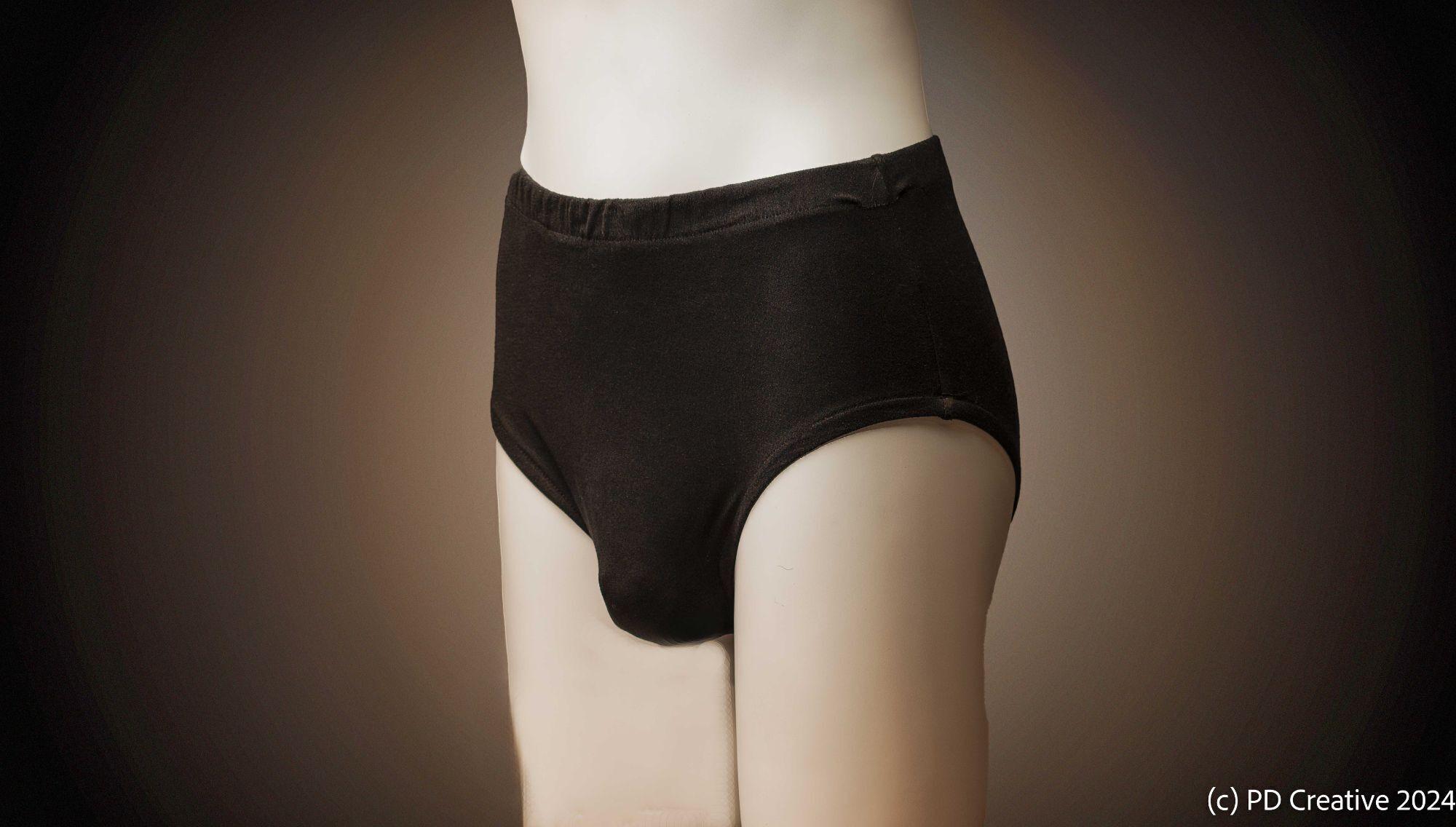 a mannequin is wearing a pair of black underwear .