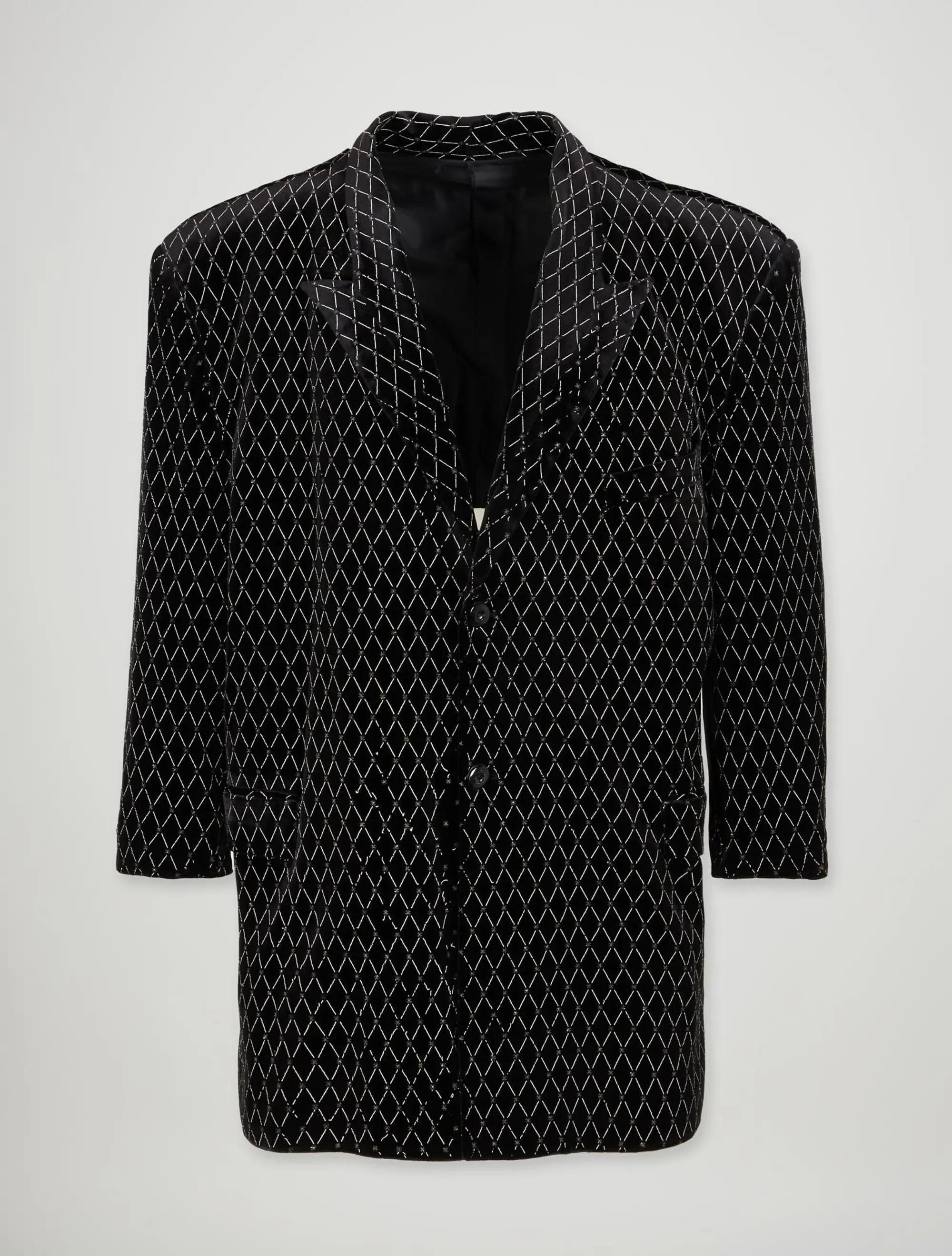 a black suit jacket with white design trim