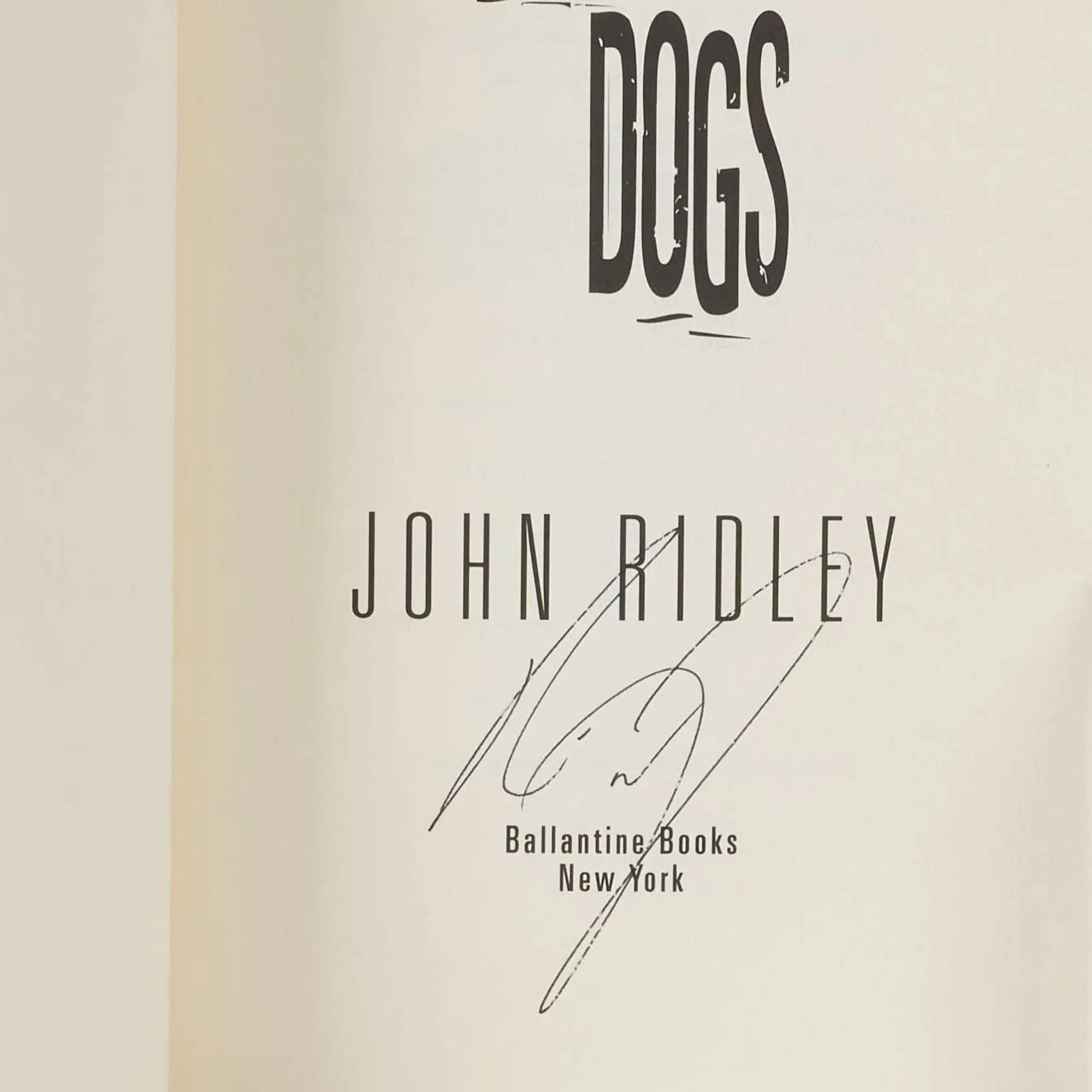 Lot #285  Stray Dogs First Edition Signed by Nick Nolte, Oliver Stone, and John Ridley