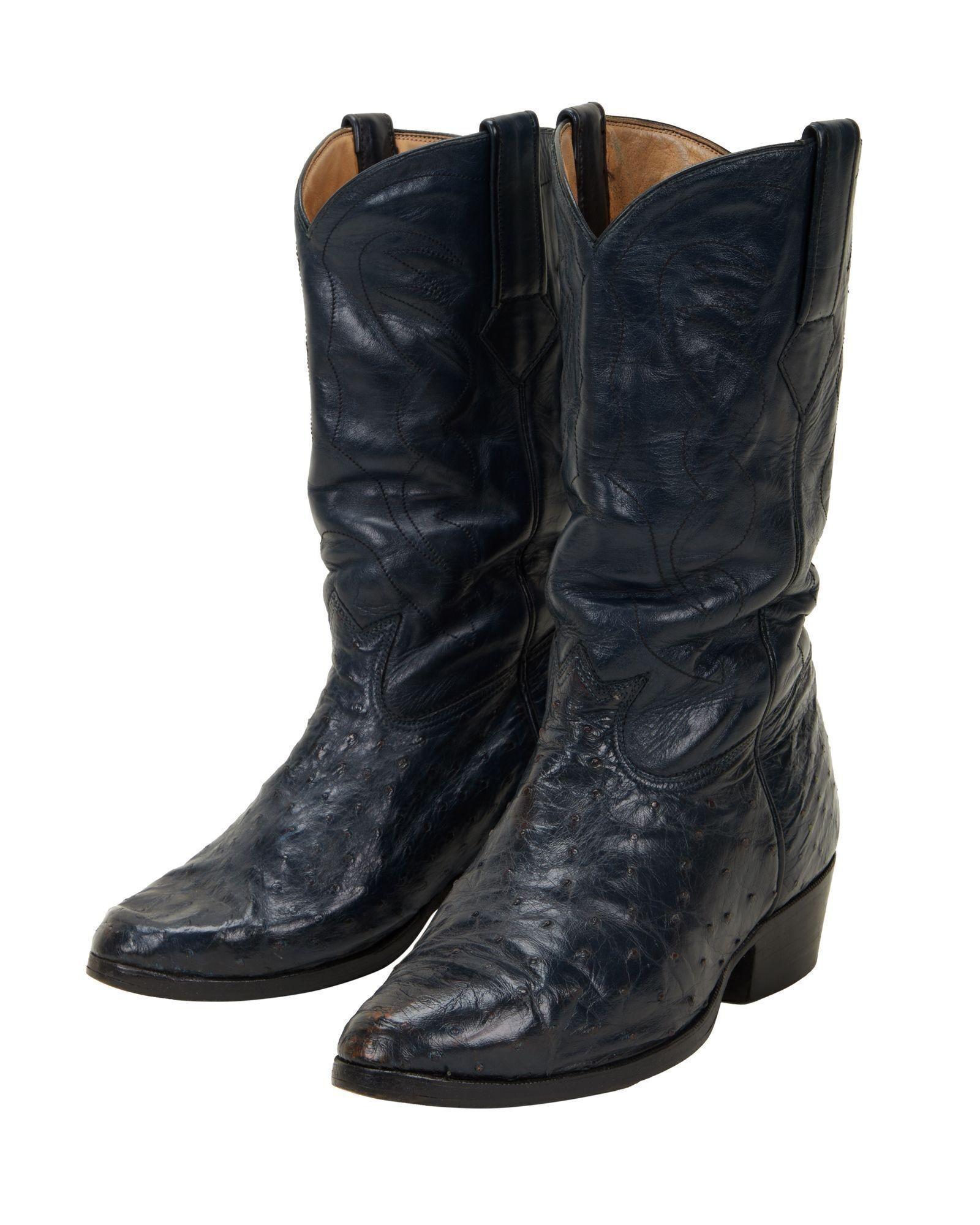 Lot #323. Burt Reynolds | Navy Ostrich Cowboy Boots a pair of black cowboy boots on a white background