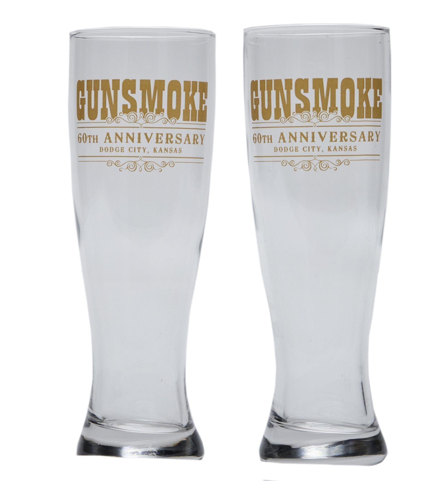 Lot #306. Burt Reynolds | "Gunsmoke" 60th Anniversary Commemorative Drinking Glasses two glasses that say gunsmoke 60th anniversary on them