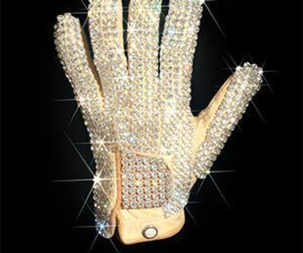 A picture of a Michael Jackson glove with diamonds on it