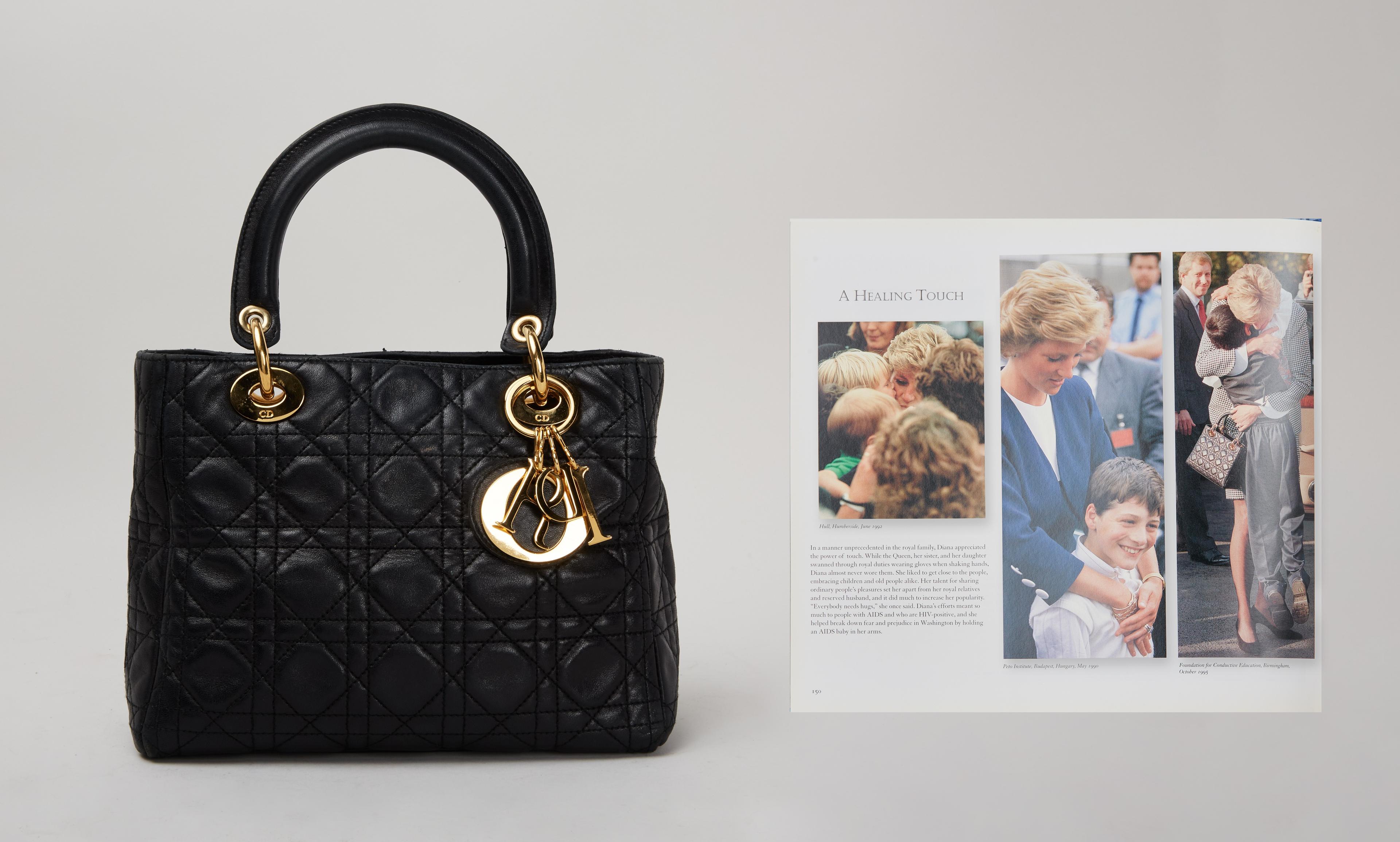 a black handbag and photo of princess diana wearing it