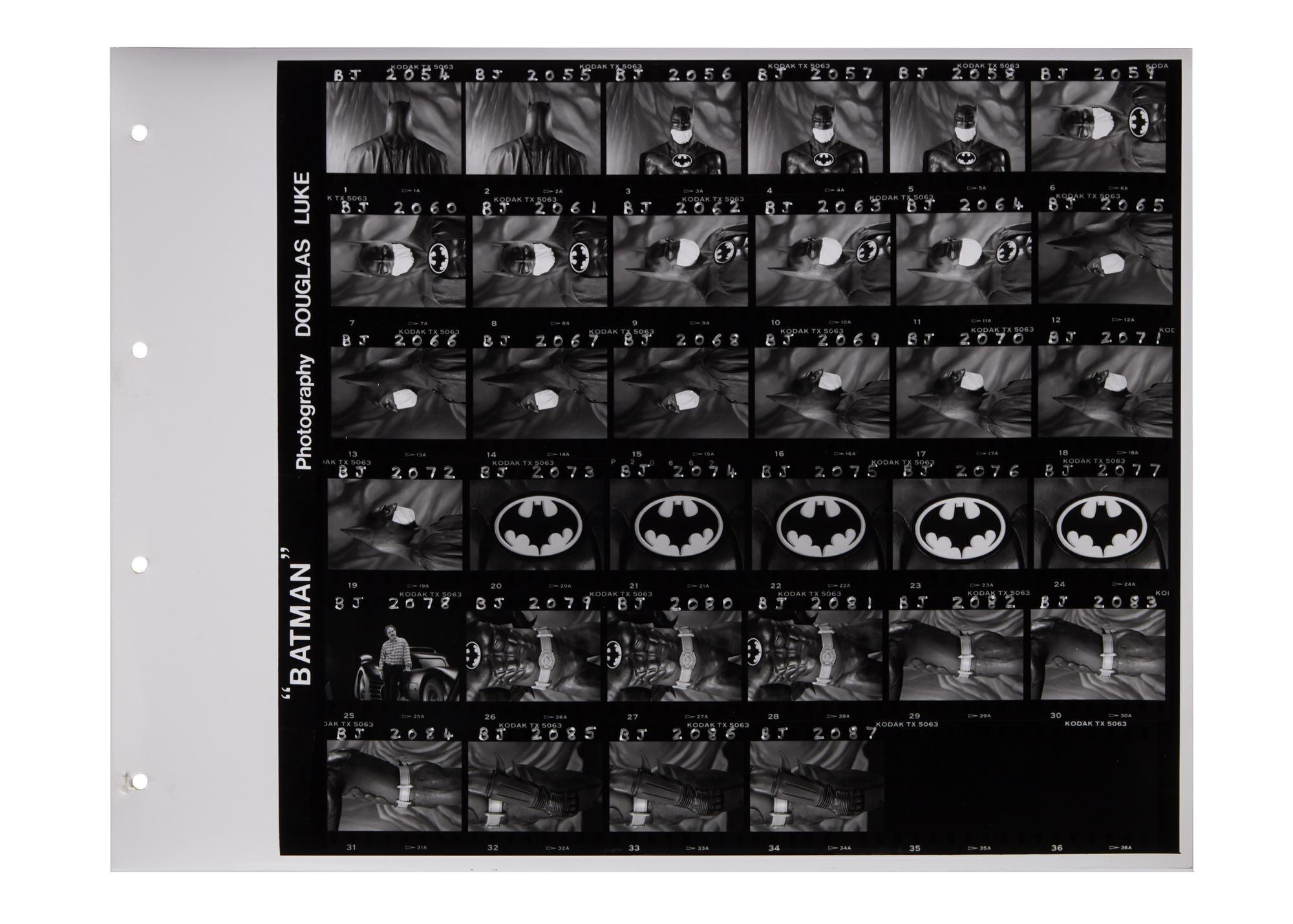 a black and white photo of batman by douglas luke .