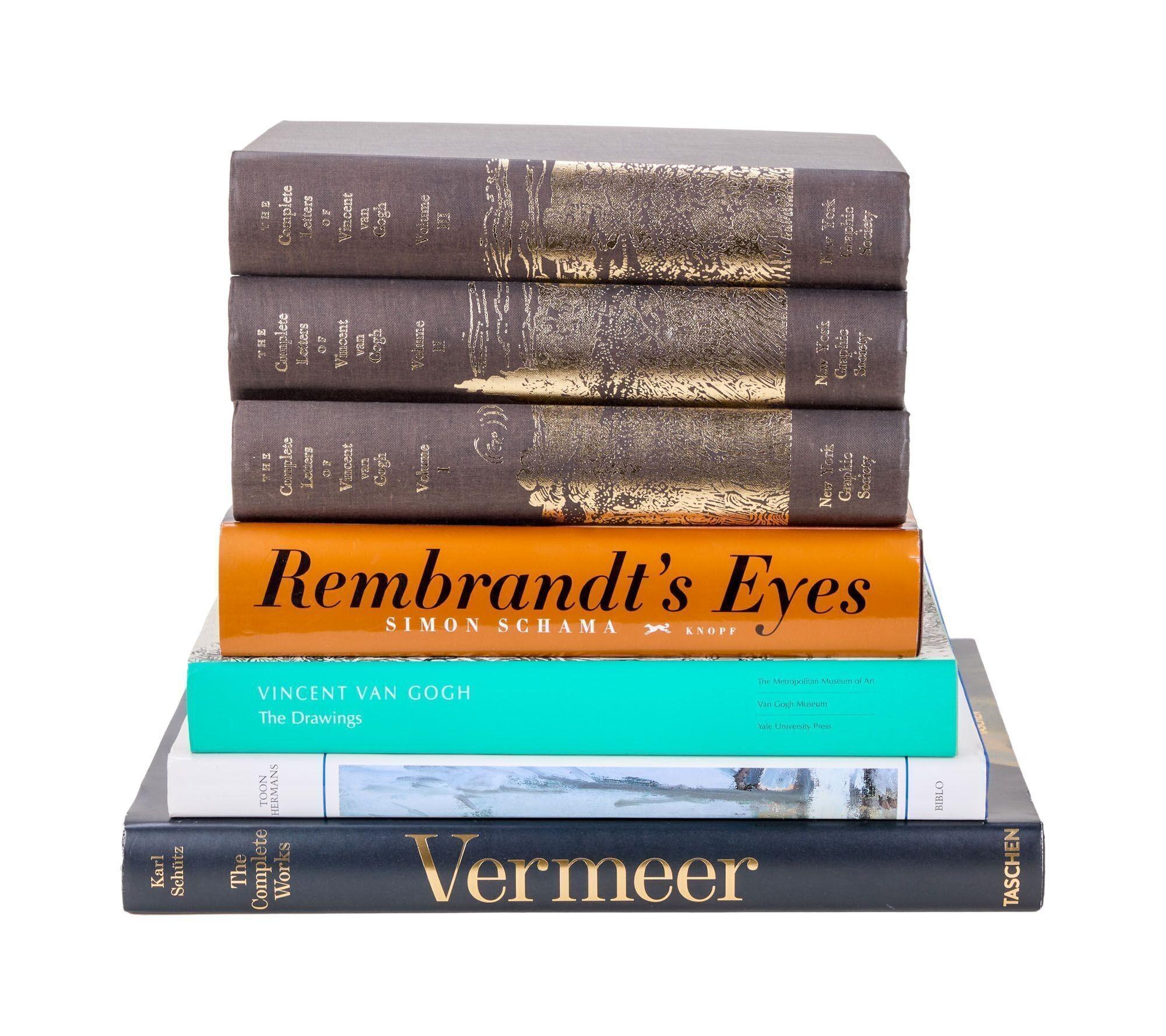 a stack of books sitting on top of each other on a white background .