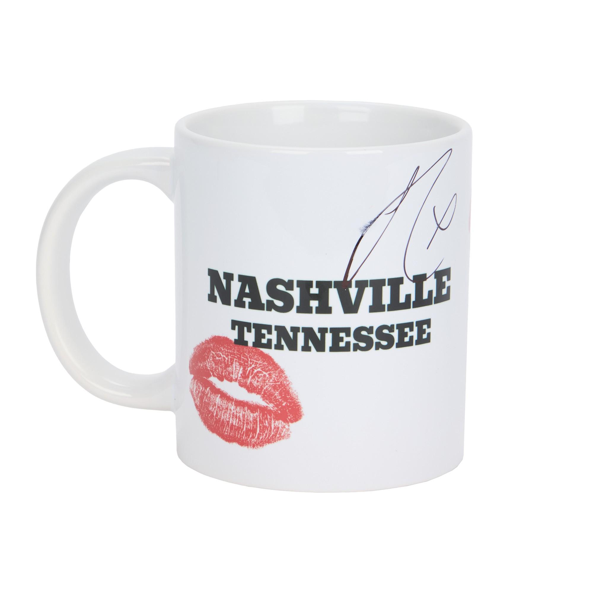 Sabrina Carpenter | 2025 Bridgestone Arena Stage-Used and Signed "Espresso" Nashville Mug White mug with "NASHVILLE TENNESSEE" text, a red kiss mark, and a black signature.