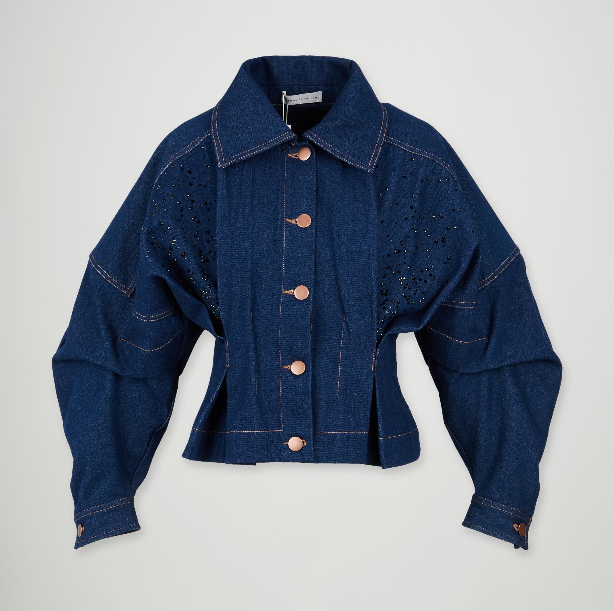 a blue denim jacket with long sleeves and buttons on a white background .