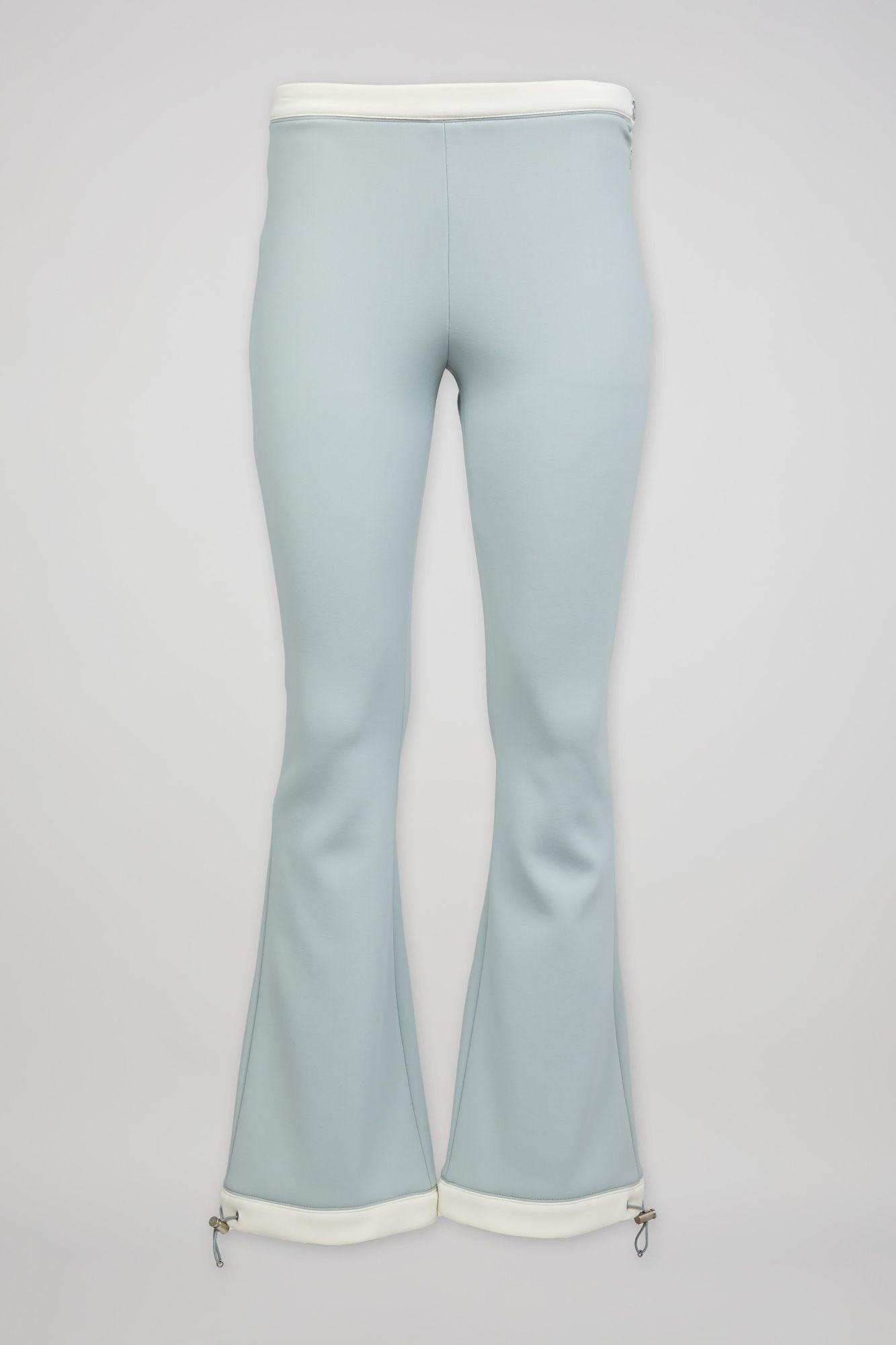 a pair of light blue flared pants with white trim