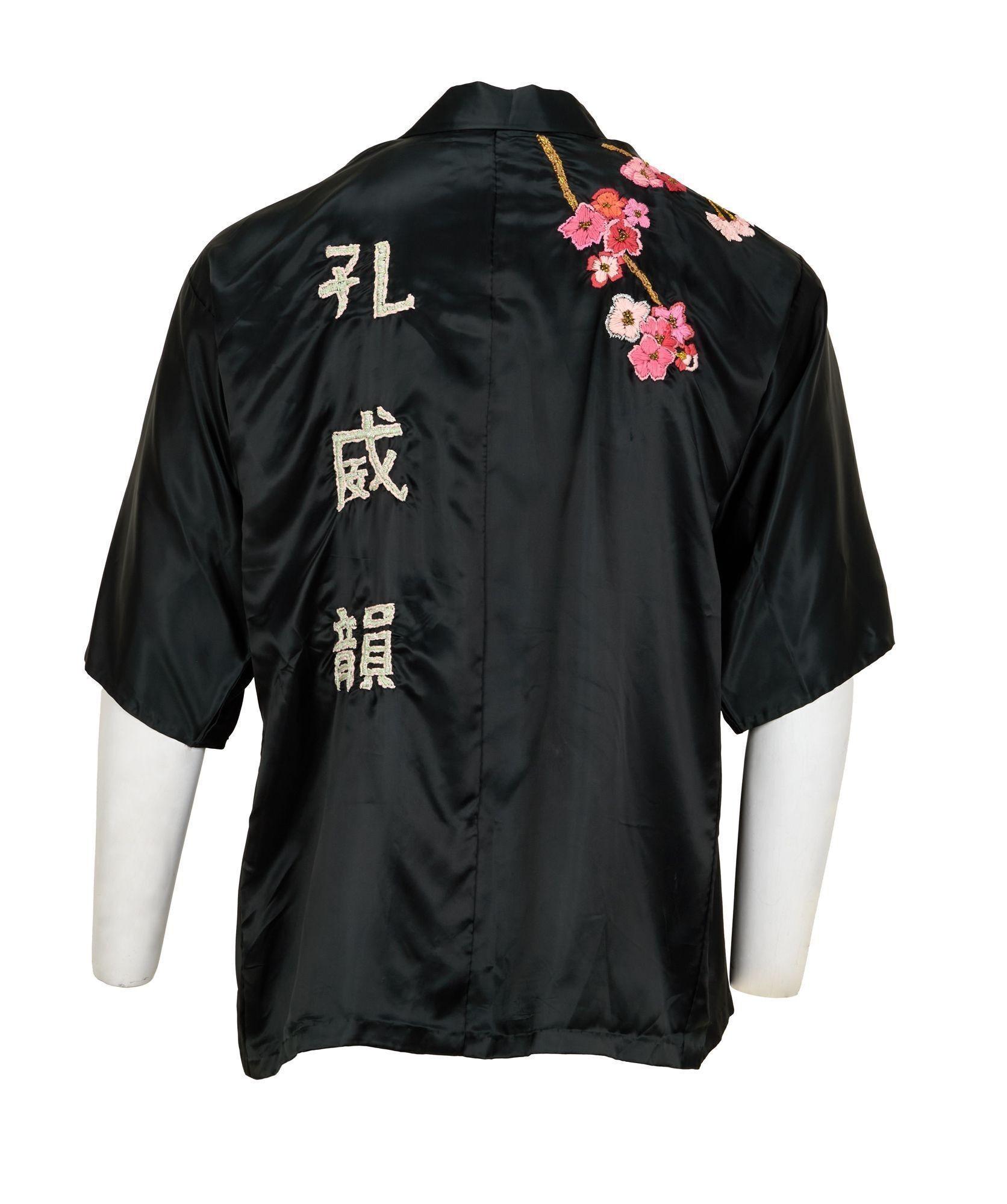 Lot #49. Freddie Mercury | Personally Owned Kimono a black shirt with chinese writing on the back