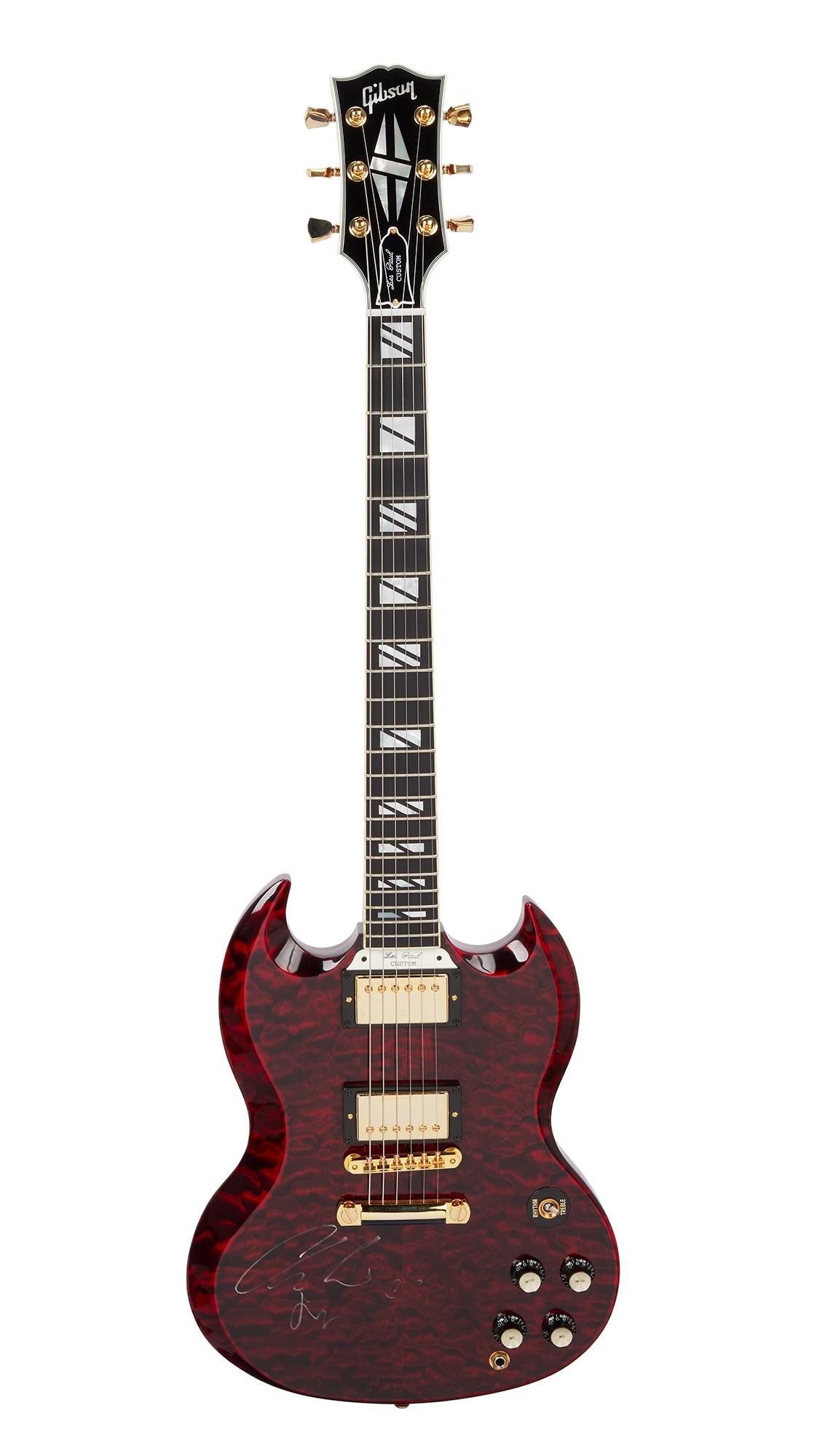 Charli XCX | Signed Gibson SG Q Electric Guitar, Fire Tiger A deep red flamed Gibson SG electric guitar with gold hardware and a signature on the body.