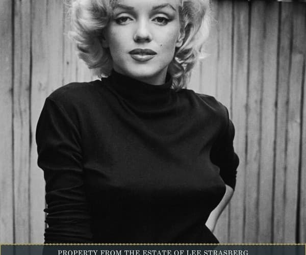 A poster for Julien's Auctions showing Marilyn Monroe