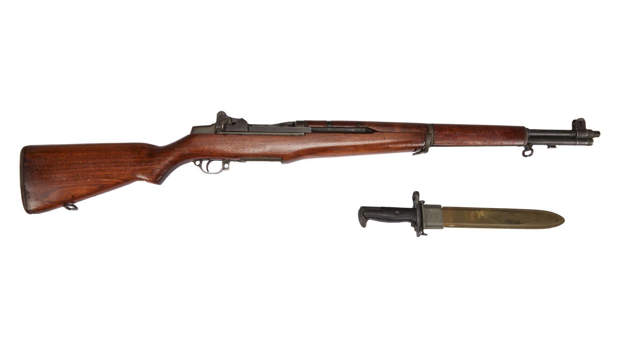a picture of a wooden rifle and a knife