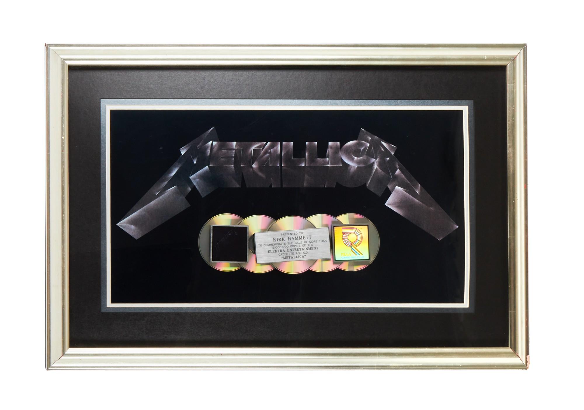a framed music plaque that reads metallica