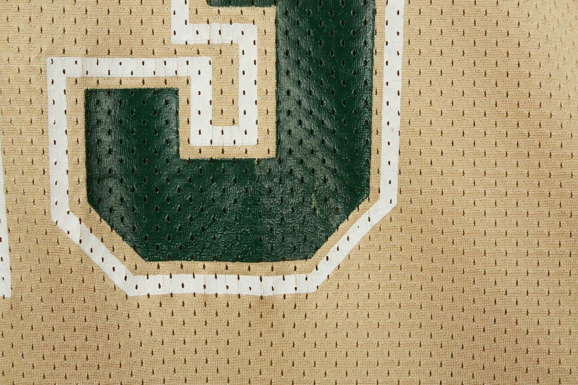 a close up of a basketball jersey with the letter u on it .