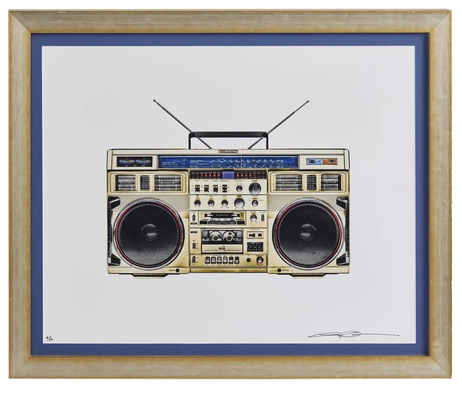 Lot #20. Lyle Owerko | "Boombox #27" Signed Limited-Edition Print A framed illustration of a vintage beige boombox with black speakers.