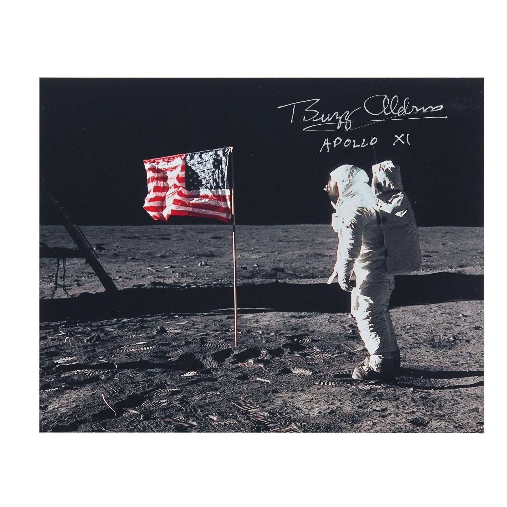 Astronaut Buzz Aldrin on the lunar surface next to an American flag, with his signature and "APOLLO XI" inscribed.