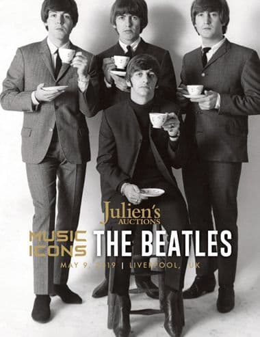 A poster for Julien's Auctions featuring The Beatles