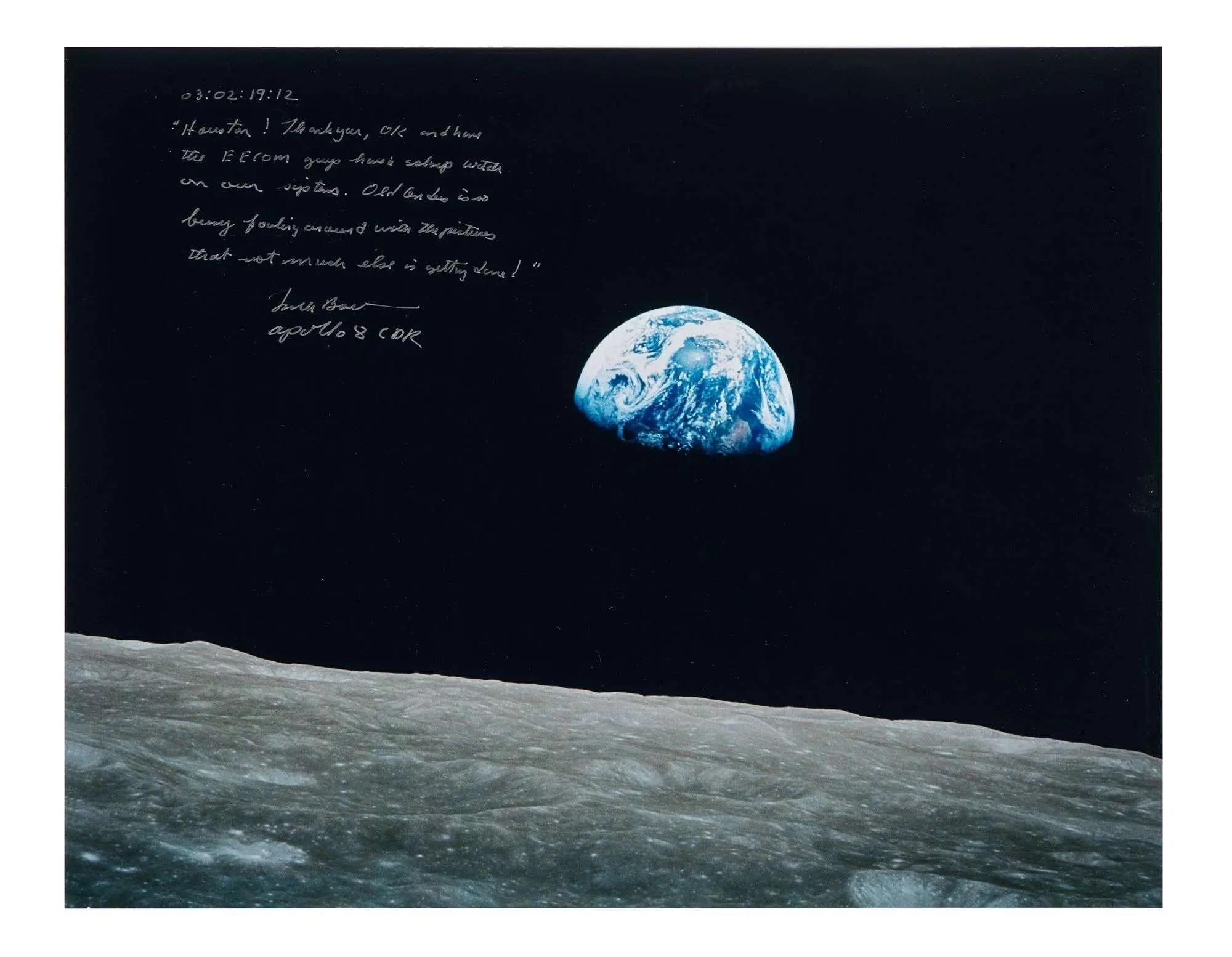 Iconic Earthrise photograph from the Moon's surface, with handwritten white text in the upper left.