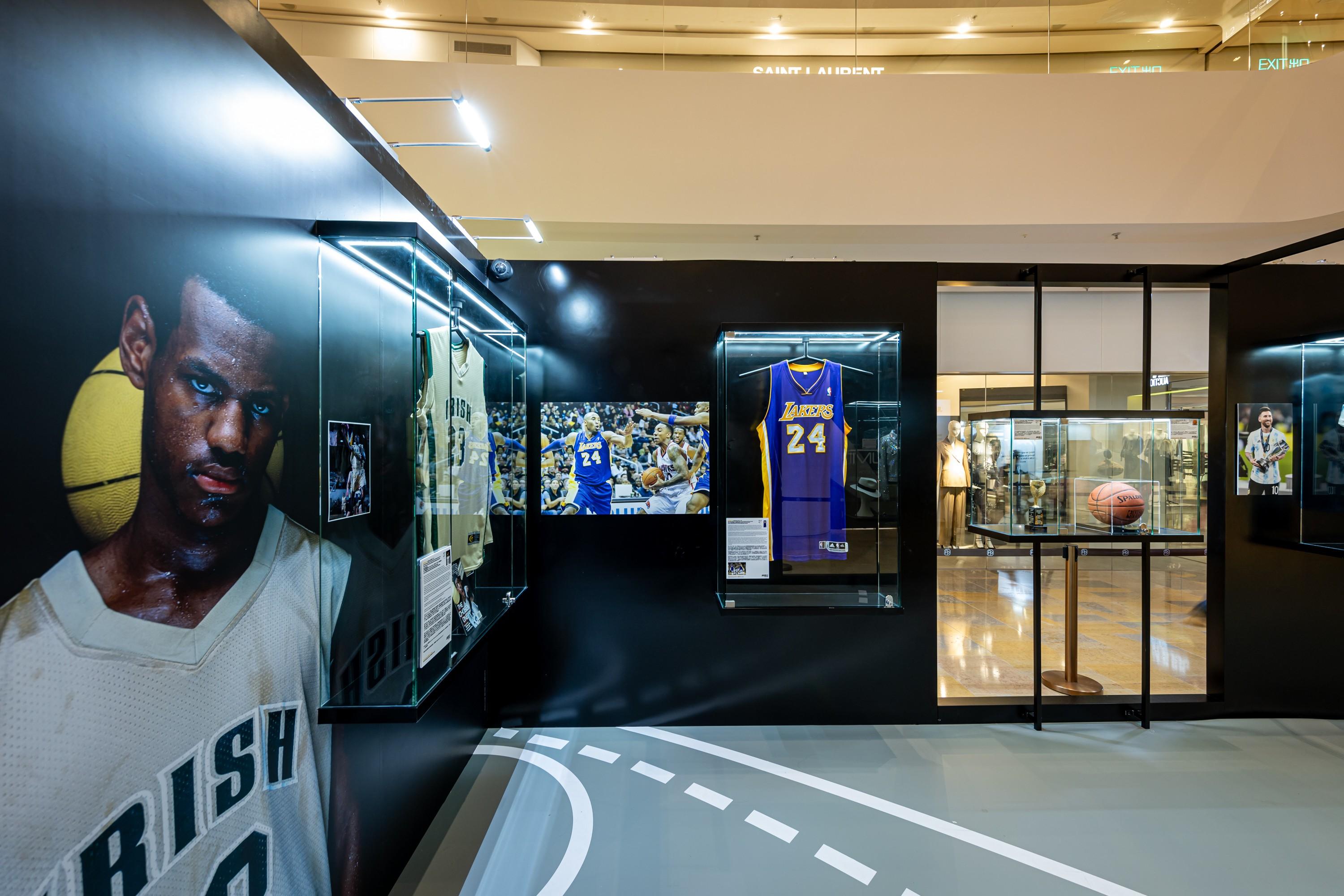 a basketball player 's jersey is on display in a museum .