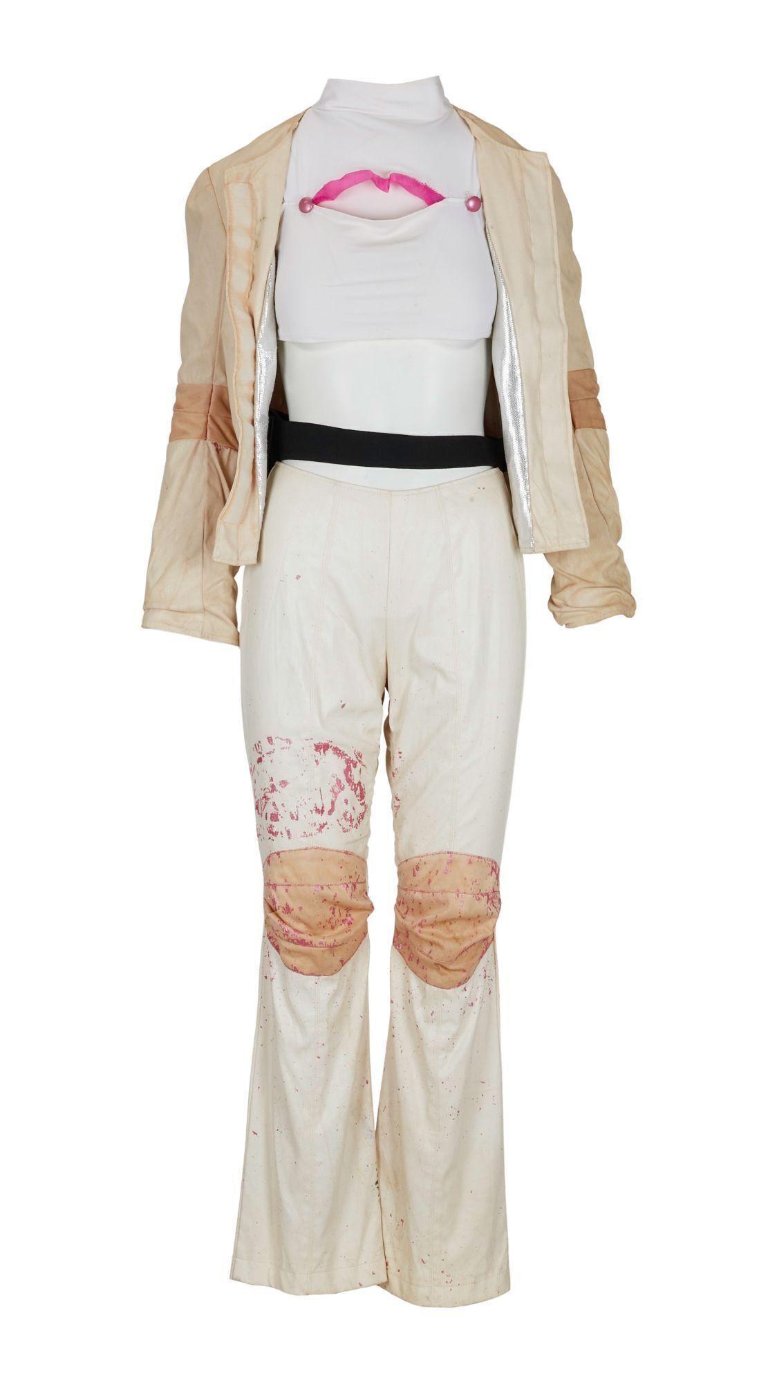 Lot #7. Britney Spears | 1999 "Baby One More Time" Tour Stage-Worn Ensemble with Doll, Ticket, Signed Photo, and Greeting Card a britney spears costume