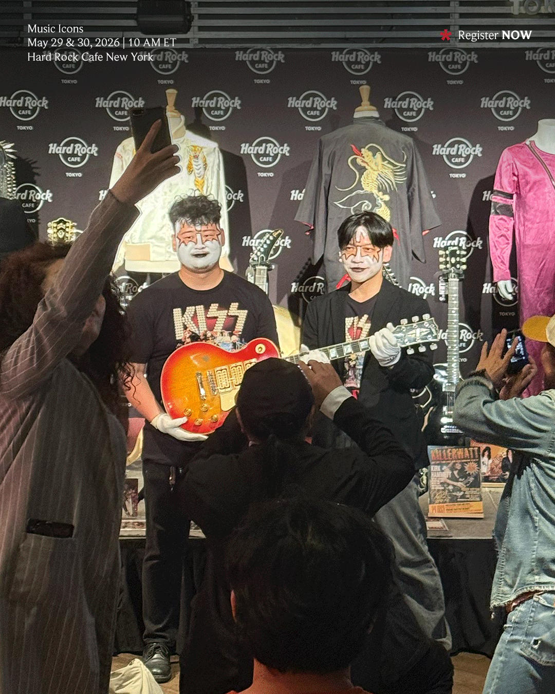 Fans in Tokyo Japan wearing gloves and holding Ace Frehley's Ace Frehley’s #1 “Budokan” 1975 Triple Pickup Gibson Les Paul Custom, Cherry Sunburst
