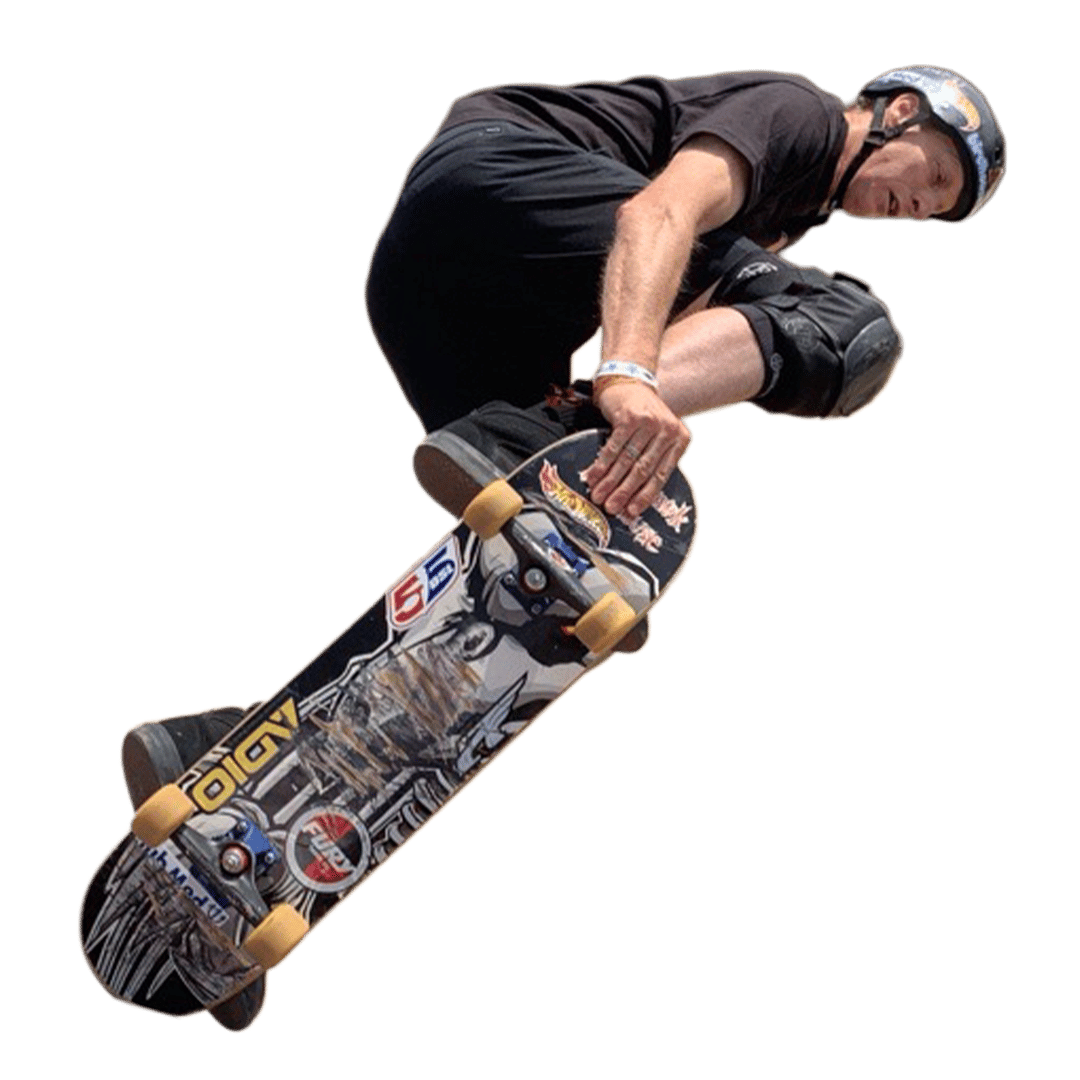 a man wearing a helmet and knee pads is riding a skateboard with a sticker that says hot wheels on it