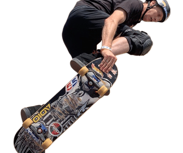 a man wearing a helmet and knee pads is riding a skateboard with a sticker that says hot wheels on it