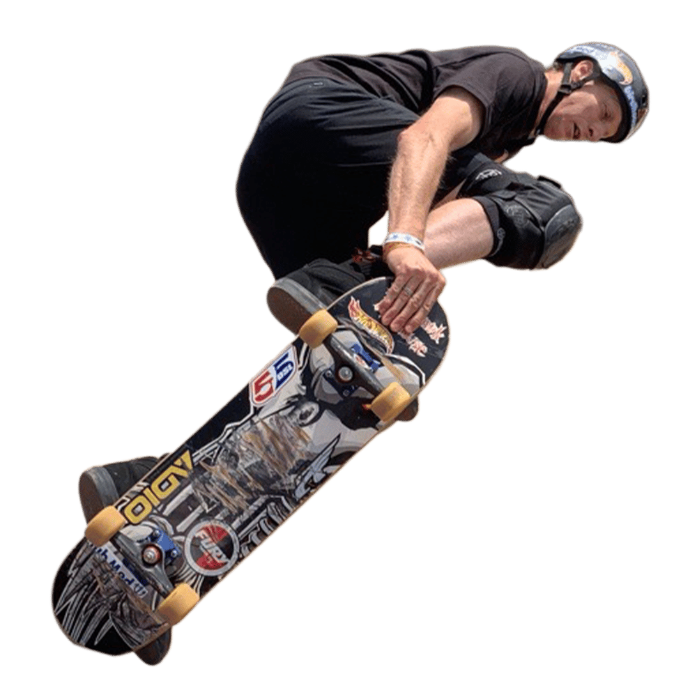 a man wearing a helmet and knee pads is riding a skateboard with a sticker that says hot wheels on it