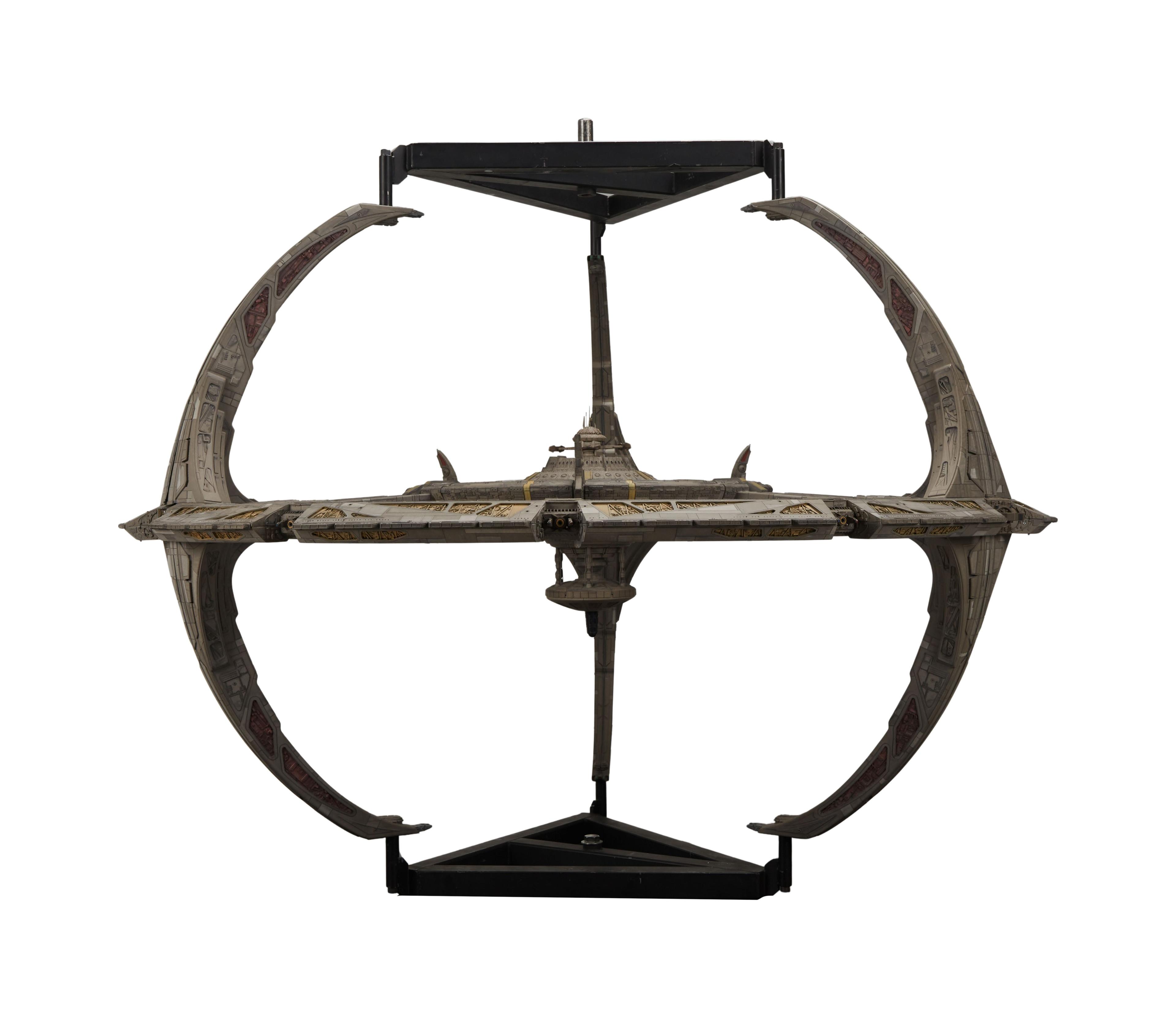 a model of a space ship on a white background .