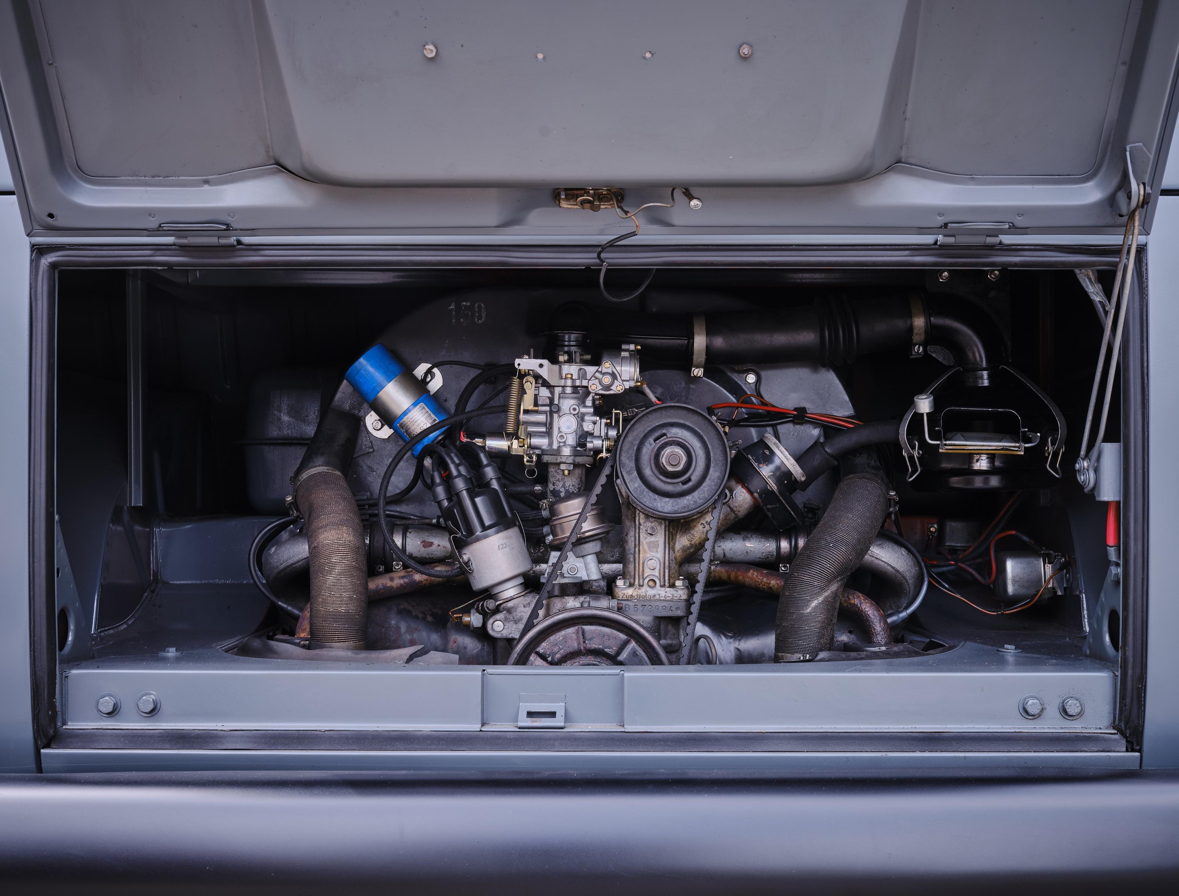 the engine compartment of a gray vw bus from the florian schneider collection