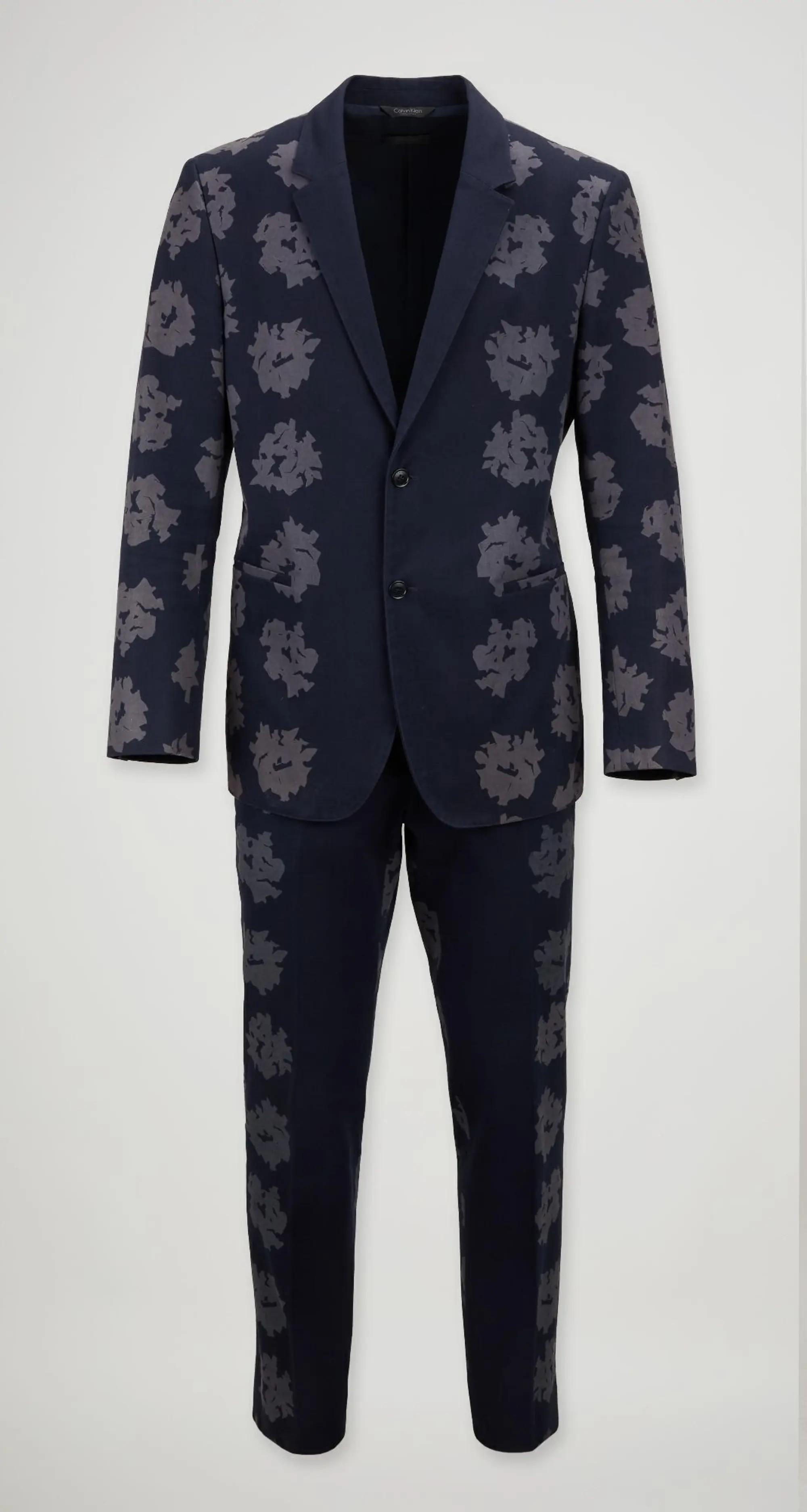 a dark blue suit with gray flowers 