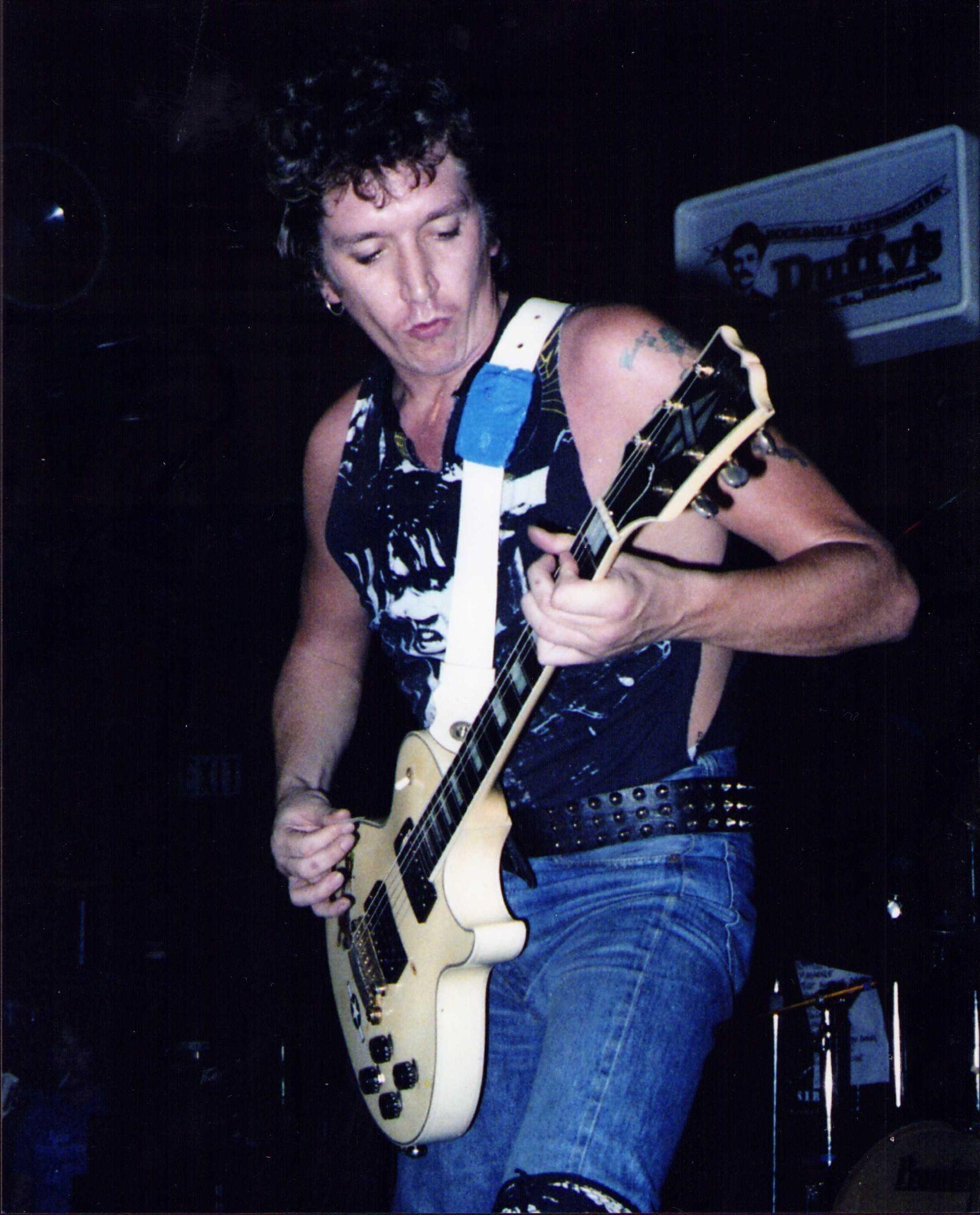 a man playing a guitar
