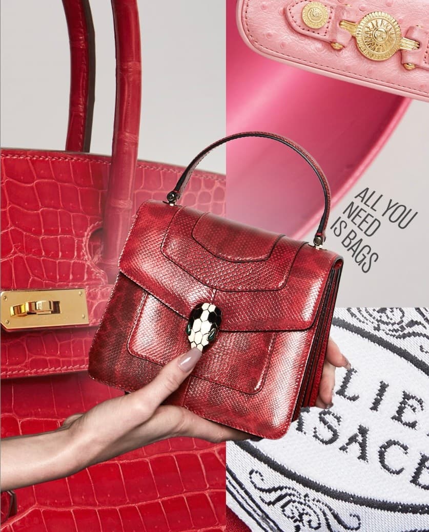 a woman is holding a red versace purse