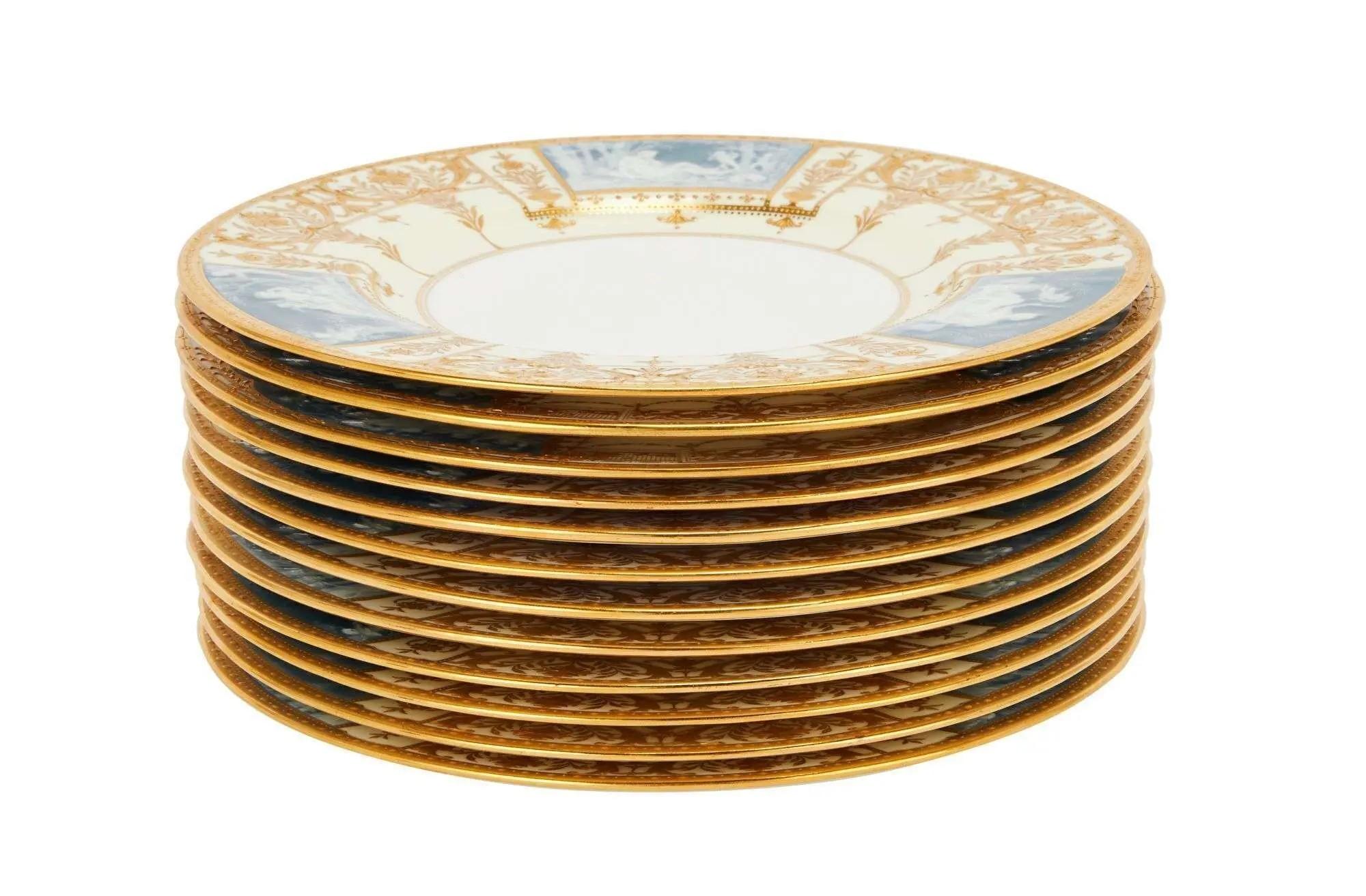 a stack of blue white and gold dinner plates