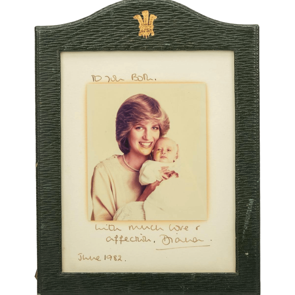 a picture of a woman holding a baby with the date june 1982