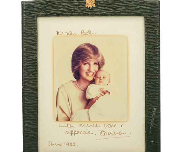 a picture of a woman holding a baby with the date june 1982