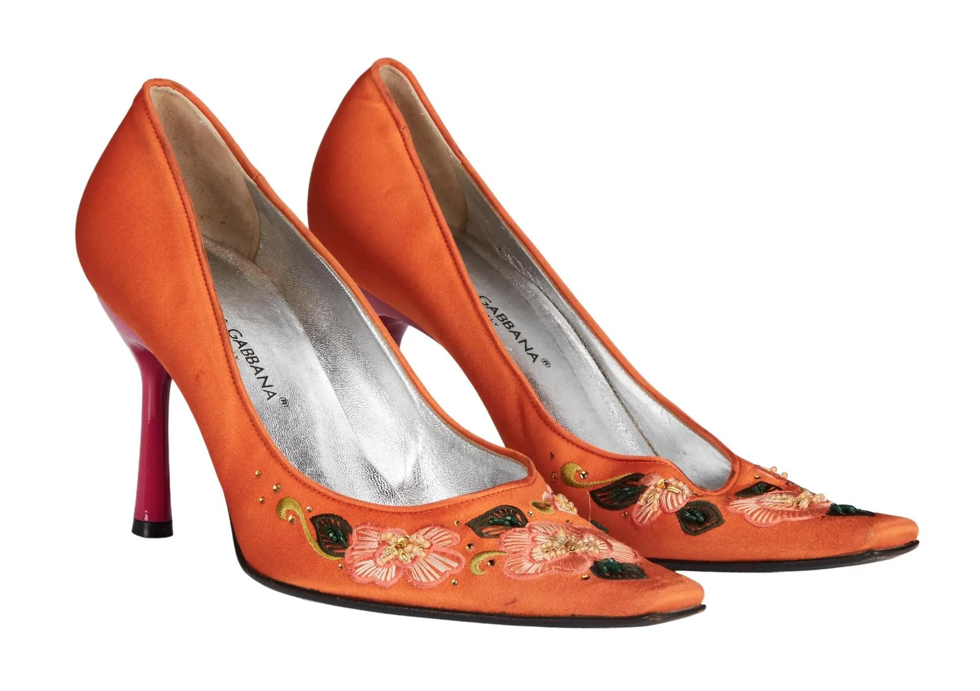 a pair of orange pumps