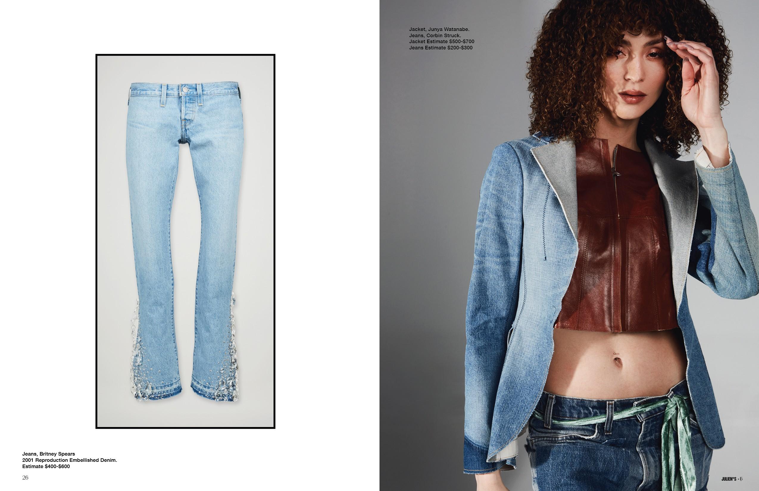 a woman is wearing a denim jacket and jeans .