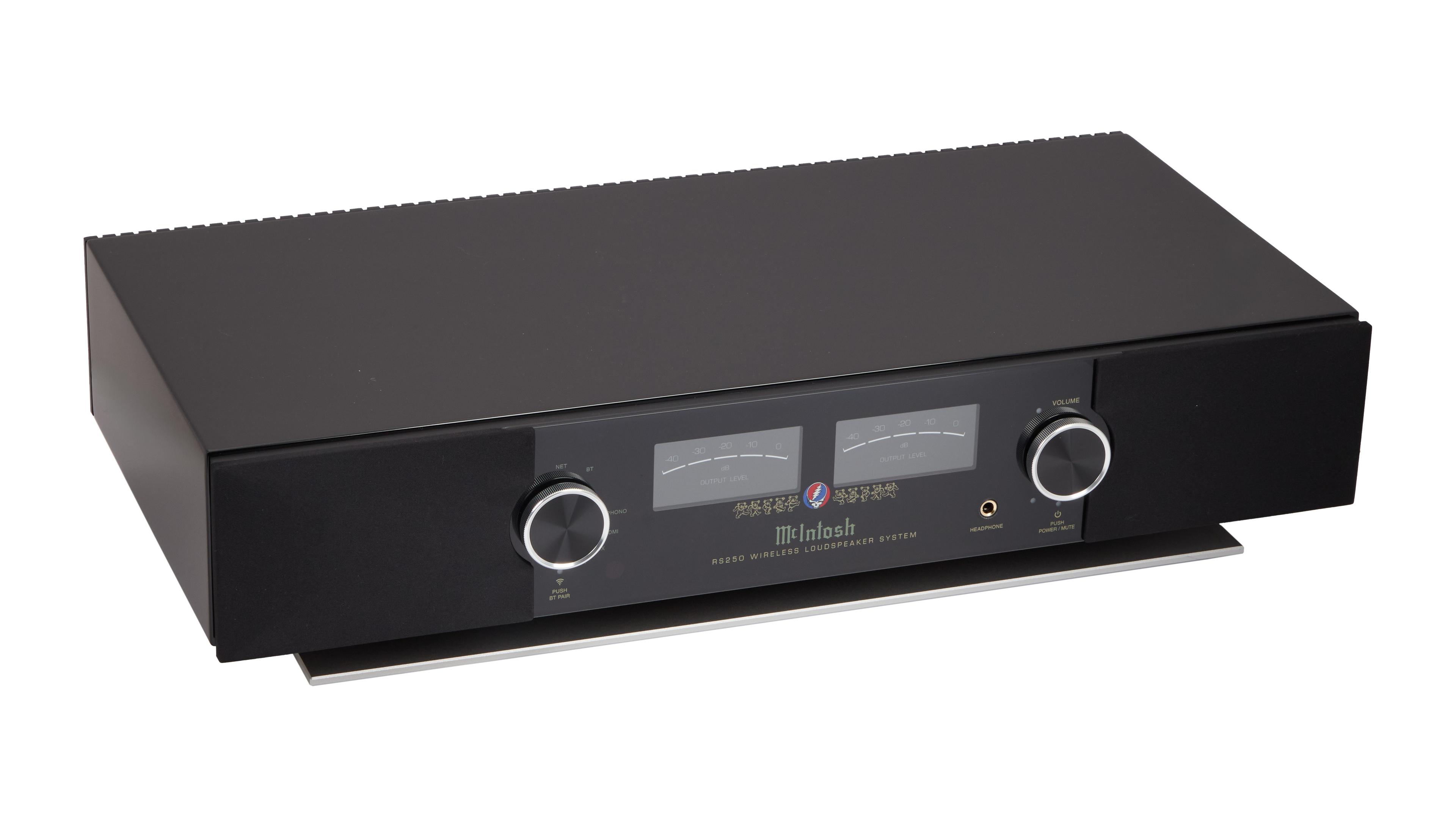 a black amplifier is sitting on top of a white table .