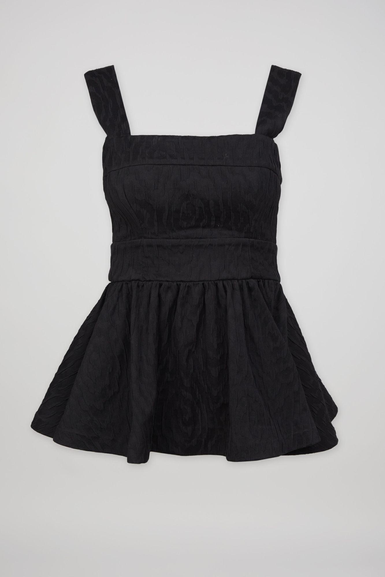 a black dress with a square neckline and a ruffled skirt