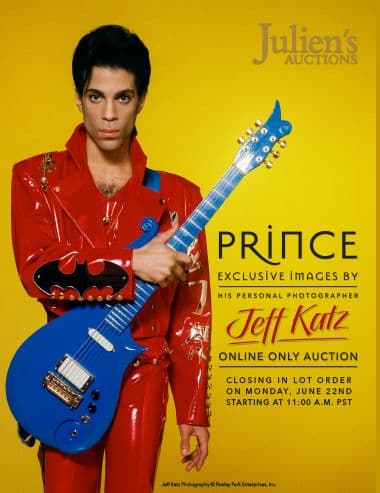 A poster of Prince holding a blue guitar for Julien's Auctions
