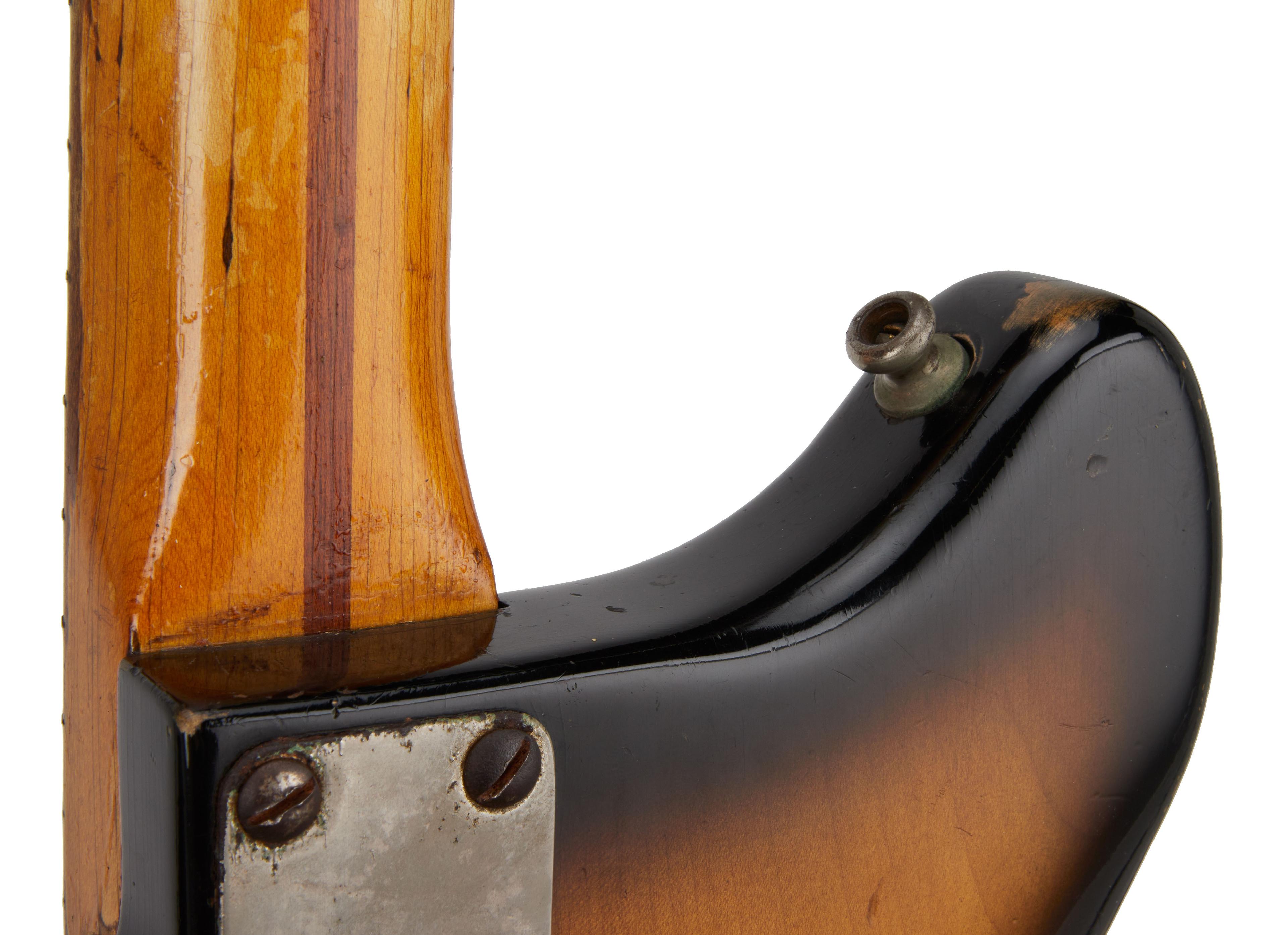 a close up of the back of a guitar on a white background .