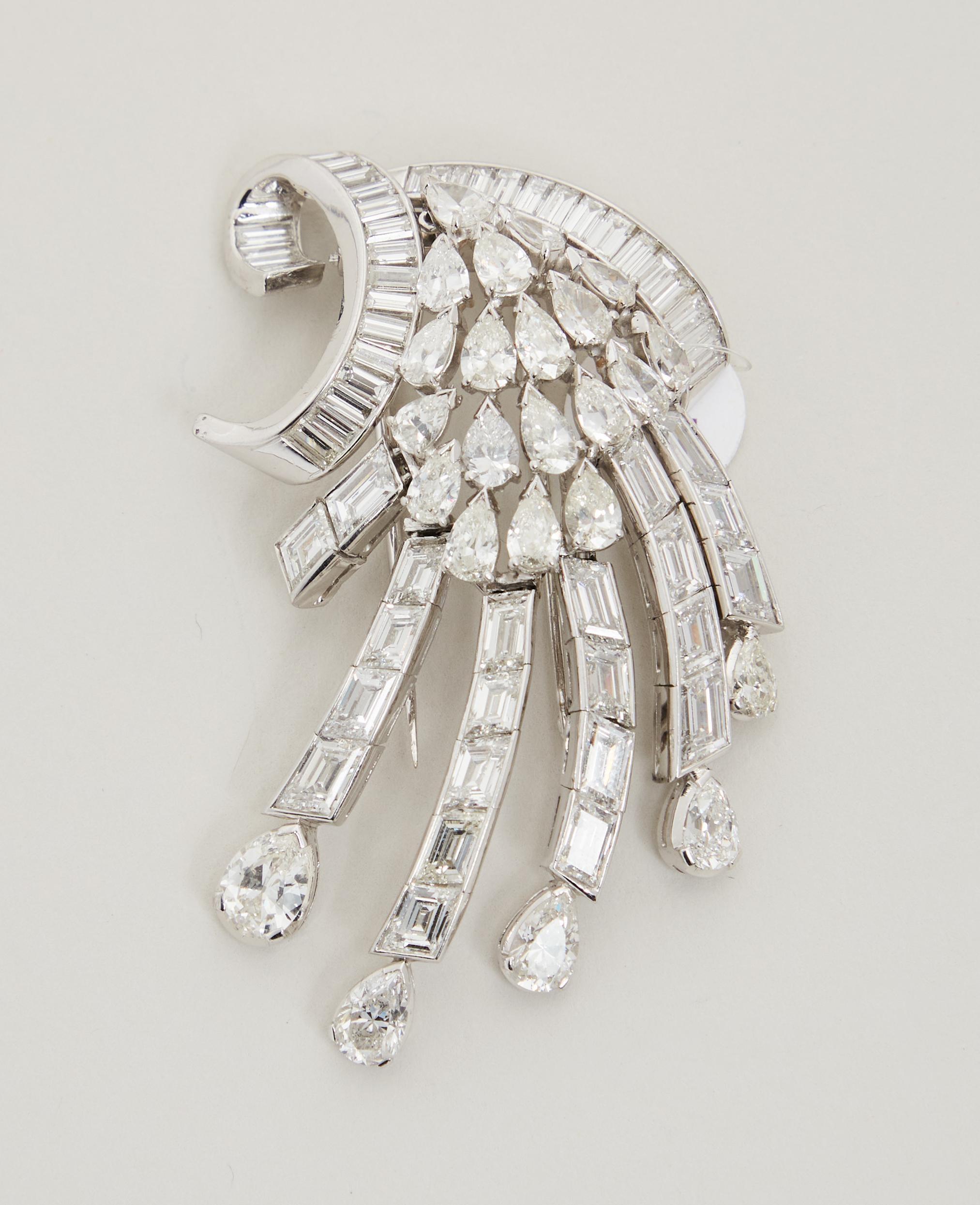 Lot #48. Elizabeth Taylor | Diamond Brooch gifted from Malcolm Forbes to Elizabeth Taylor a brooch with a lot of diamonds on it is on a white surface .