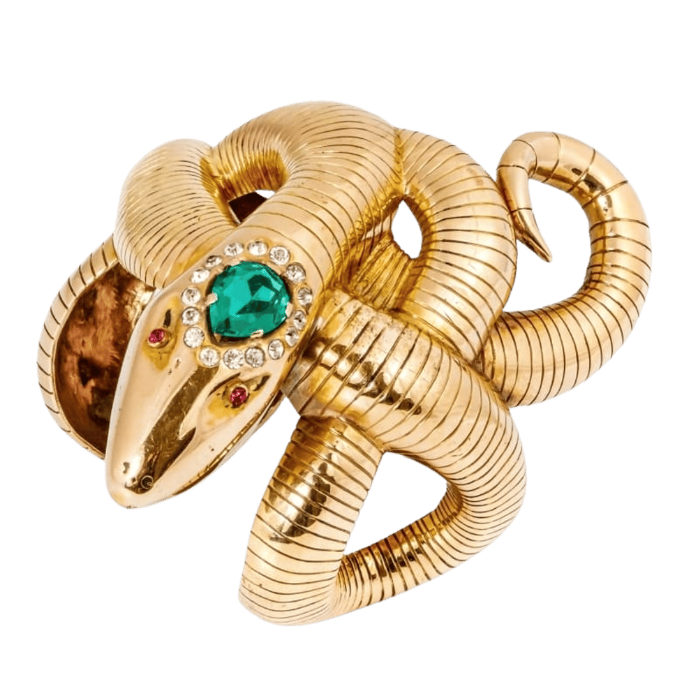 a gold snake ring with emeralds and diamonds