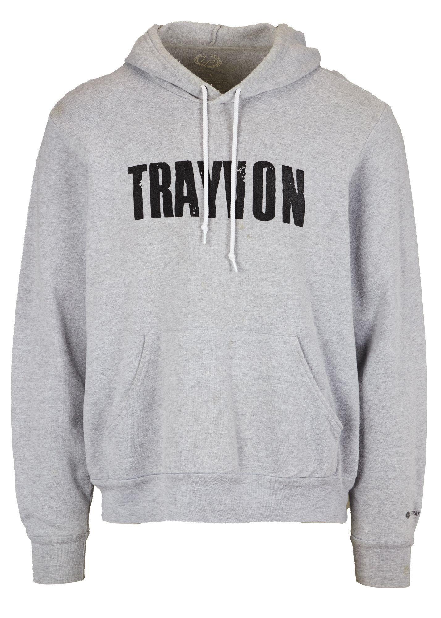 a grey hoodie with the word travion on it