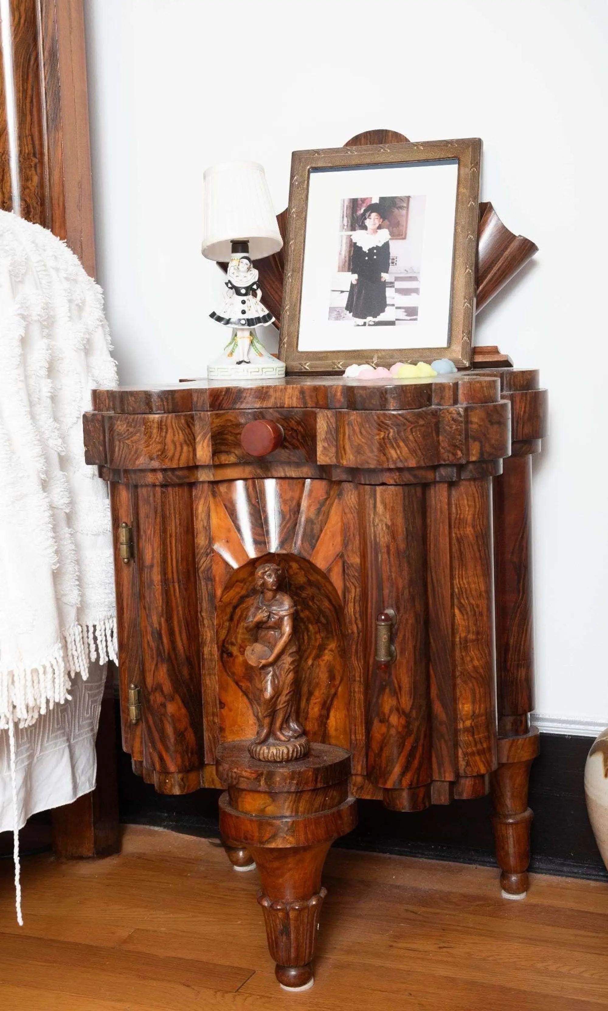 a wooden side table to a bed set