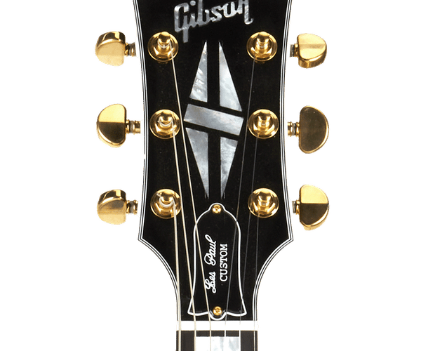 a close up of a gibson guitar headstock