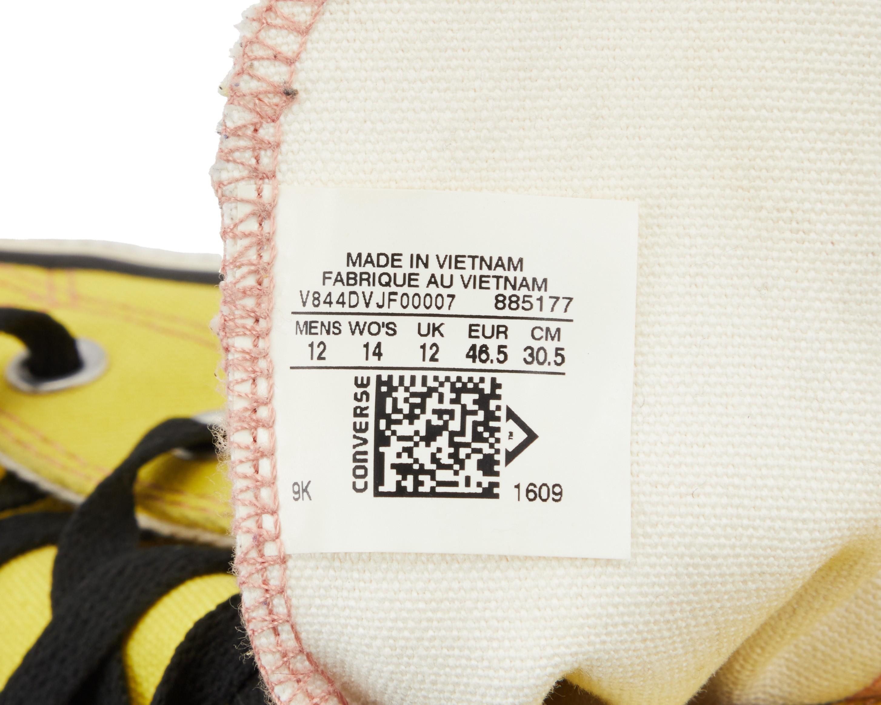 a close up of a label on a pair of converse shoes .