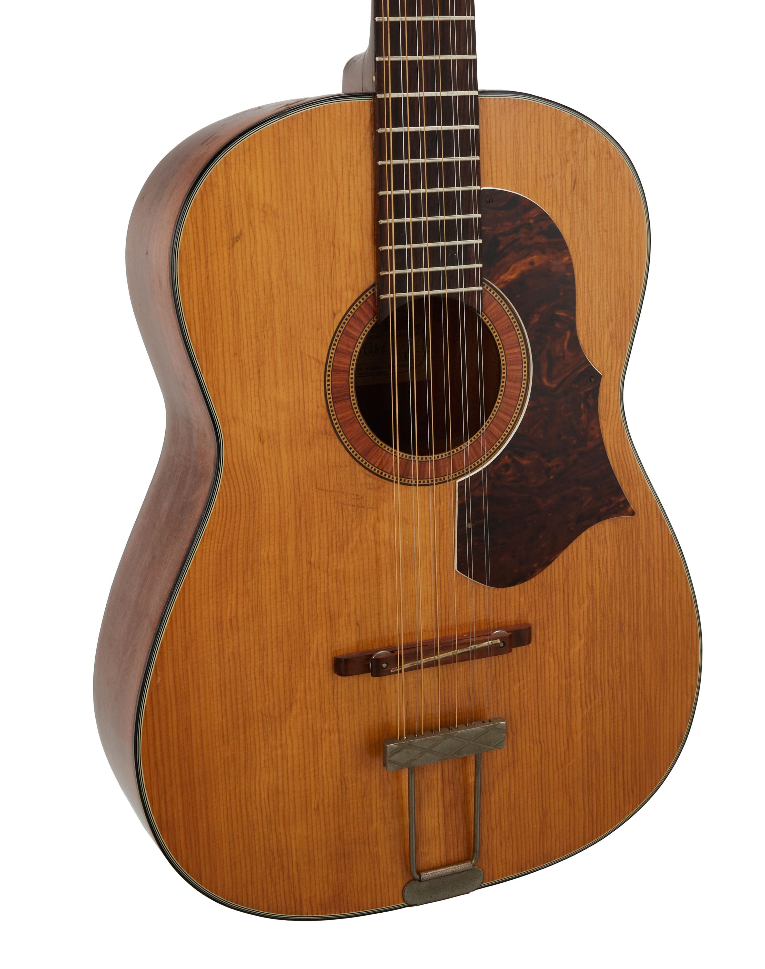 a close up of an acoustic guitar on a white background